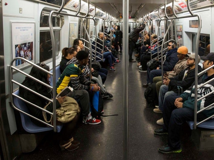 Commuters ride an L train for the morning commute in New York, U.S. on October 24, 2014. REUTERS/Lucas Jackson/File Photo