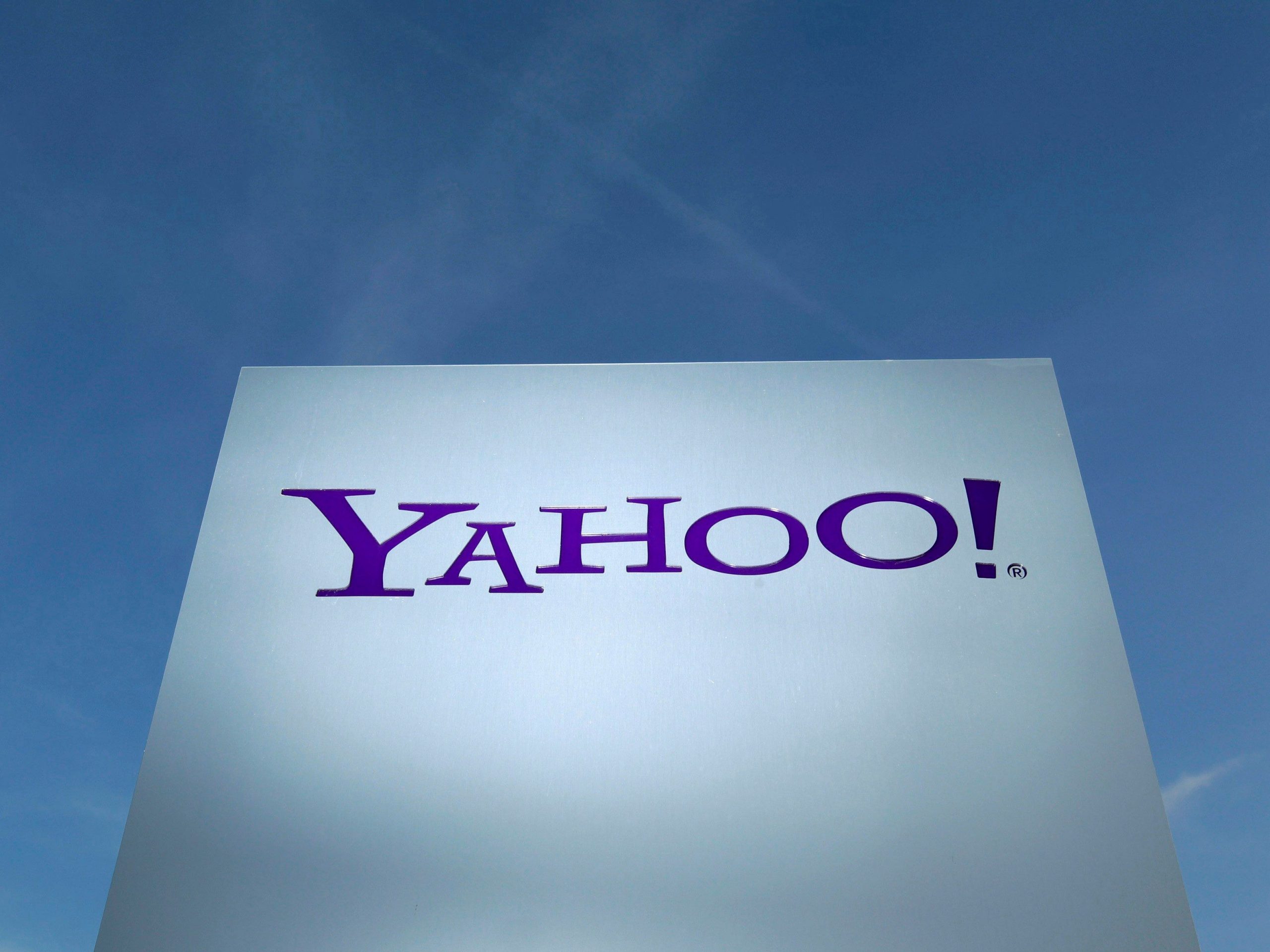 A Yahoo logo is pictured in front of a building in Rolle, Switzerland December 12, 2012. REUTERS/Denis Balibouse