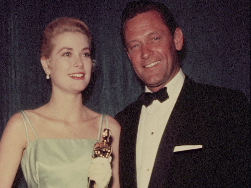 Grace Kelly and William Holden attend the 27th Academy Awards ceremony in 1955.