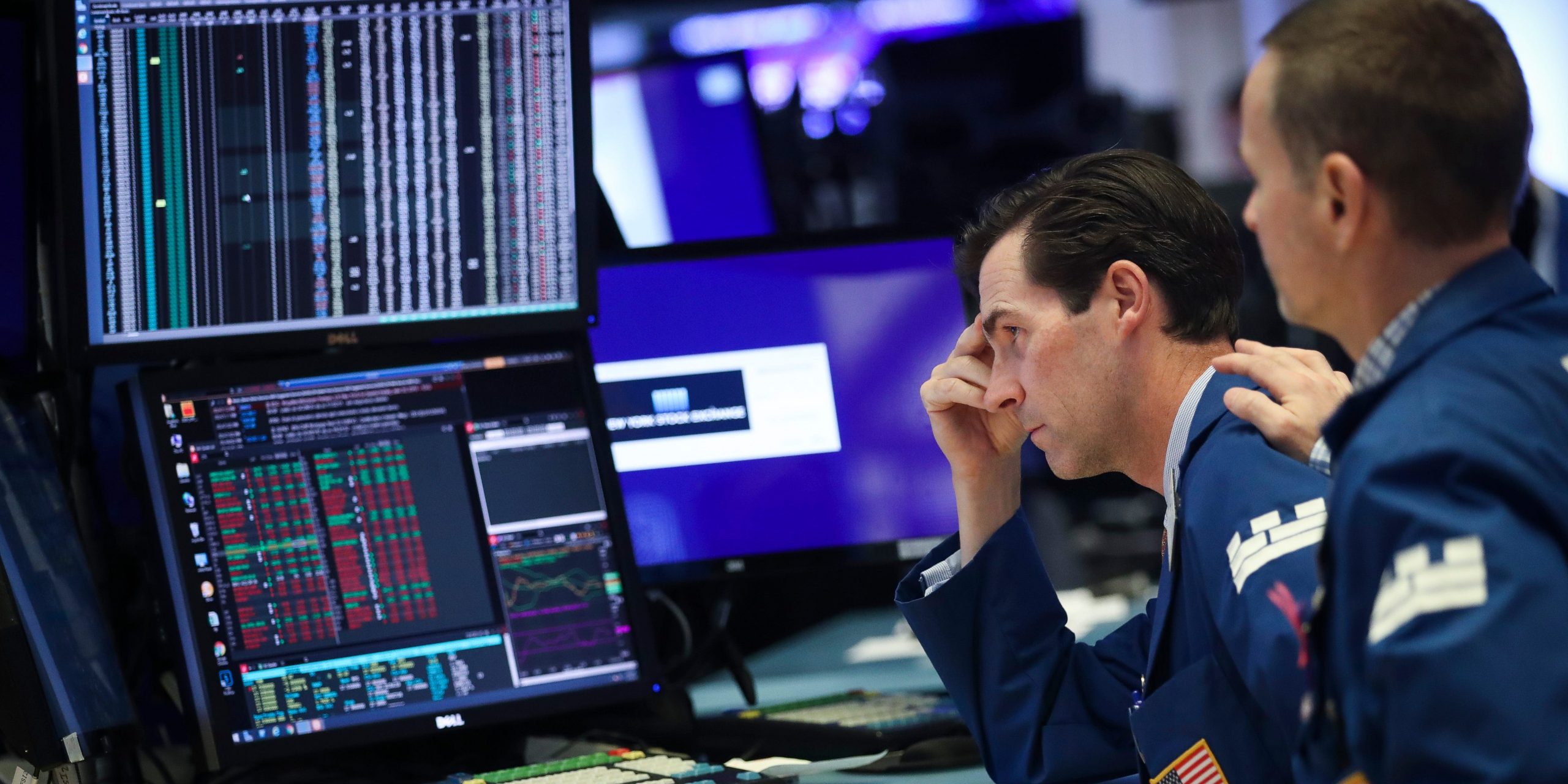 Traders and financial professionals work ahead of the closing bell on the floor of the New York Stock Exchange (NYSE) from Getty Images