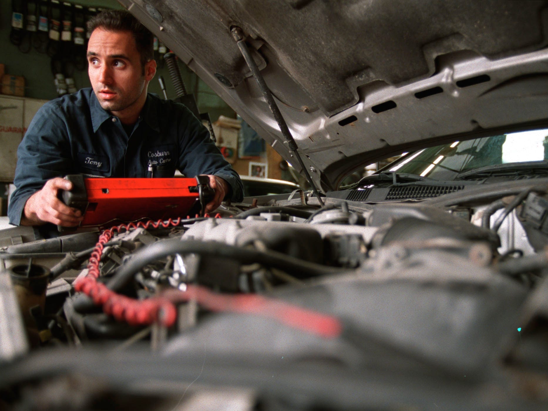 car mechanic, car repair, looking under the hood of a car