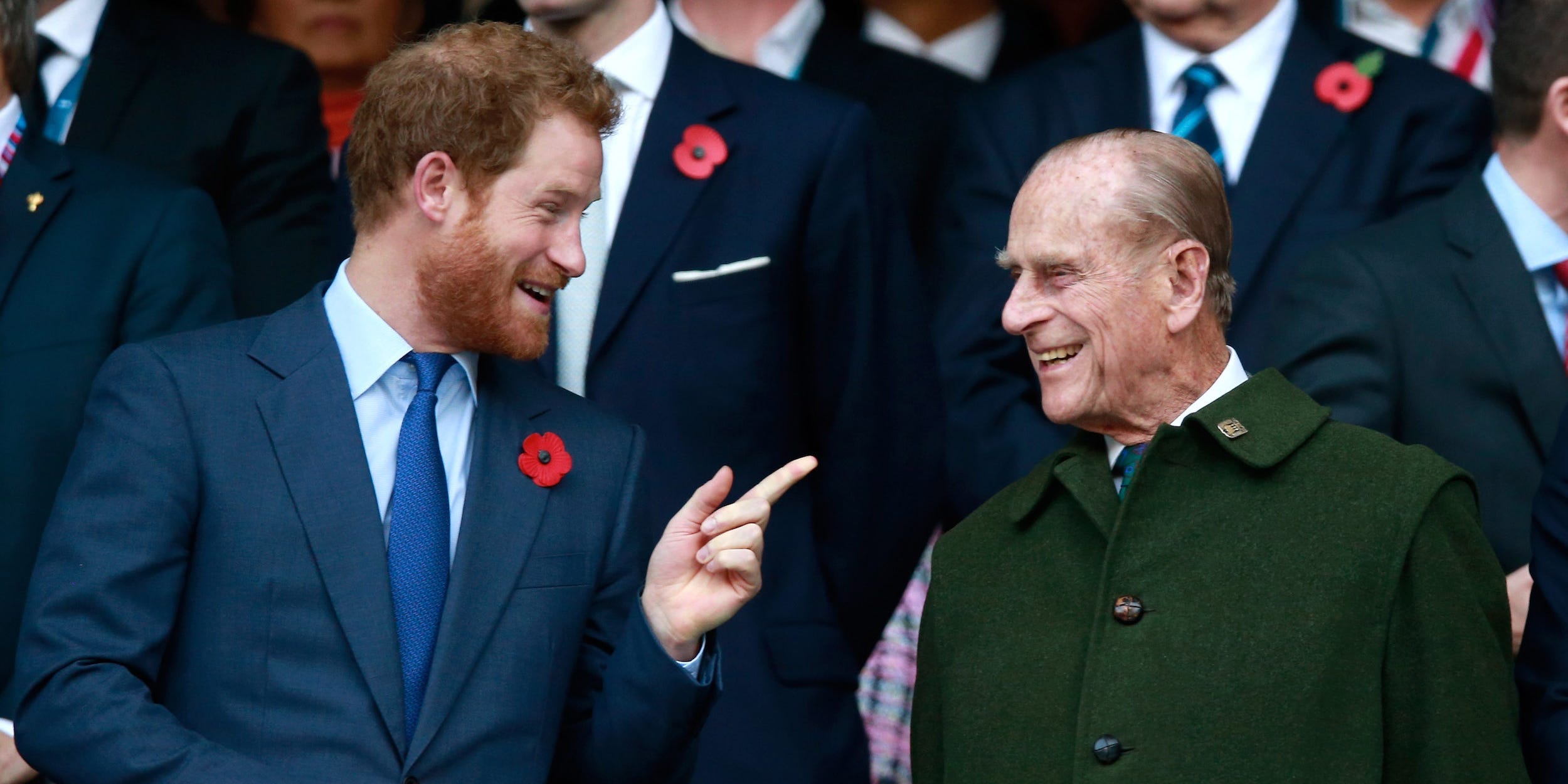 Prince Harry and Prince Phillip enjoy the atmosphere during the 2015 Rugby World Cup Final match between New Zealand and Australia at Twickenham Stadium on October 31, 2015 in London, United Kingdom.