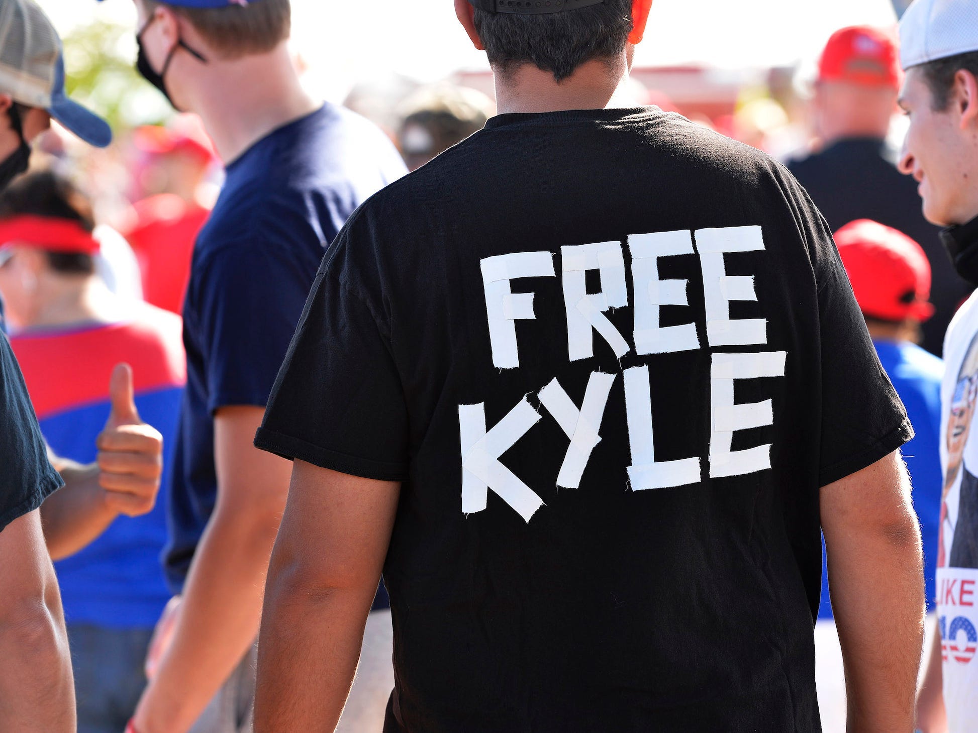 A man wears a shirt calling for freedom for Kyle Rittenhouse, 17, the man who allegedly shot protesters in Wisconsin, during a US President Donald Trump Campaign Rally, the day after the end of the Republican National Convention, at Manchester airport in Londonderry, New Hampshire, on August 28.