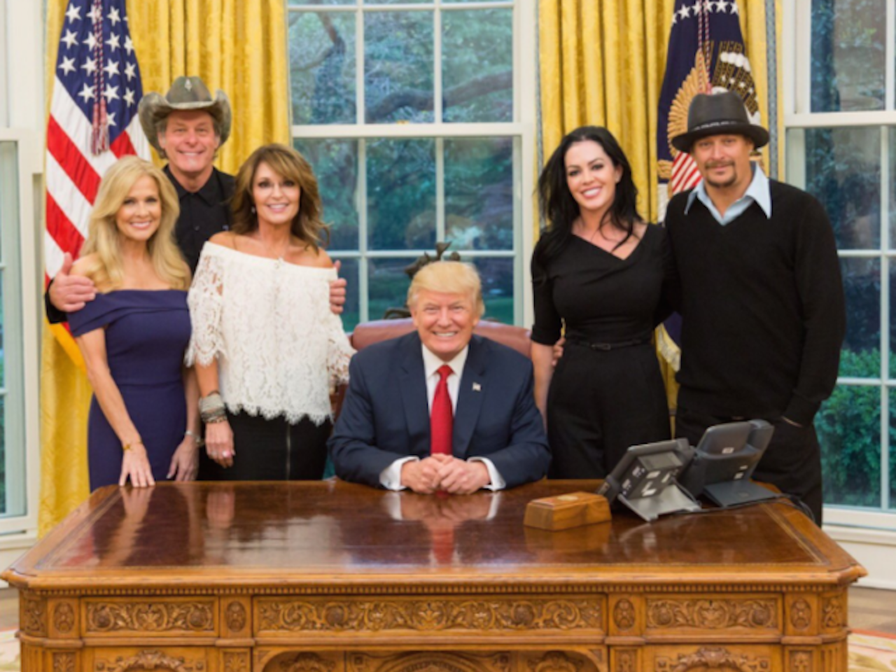 Sarah Palin, Ted Nugent, and Kid Rock pose with Donald Trump in the Oval Office