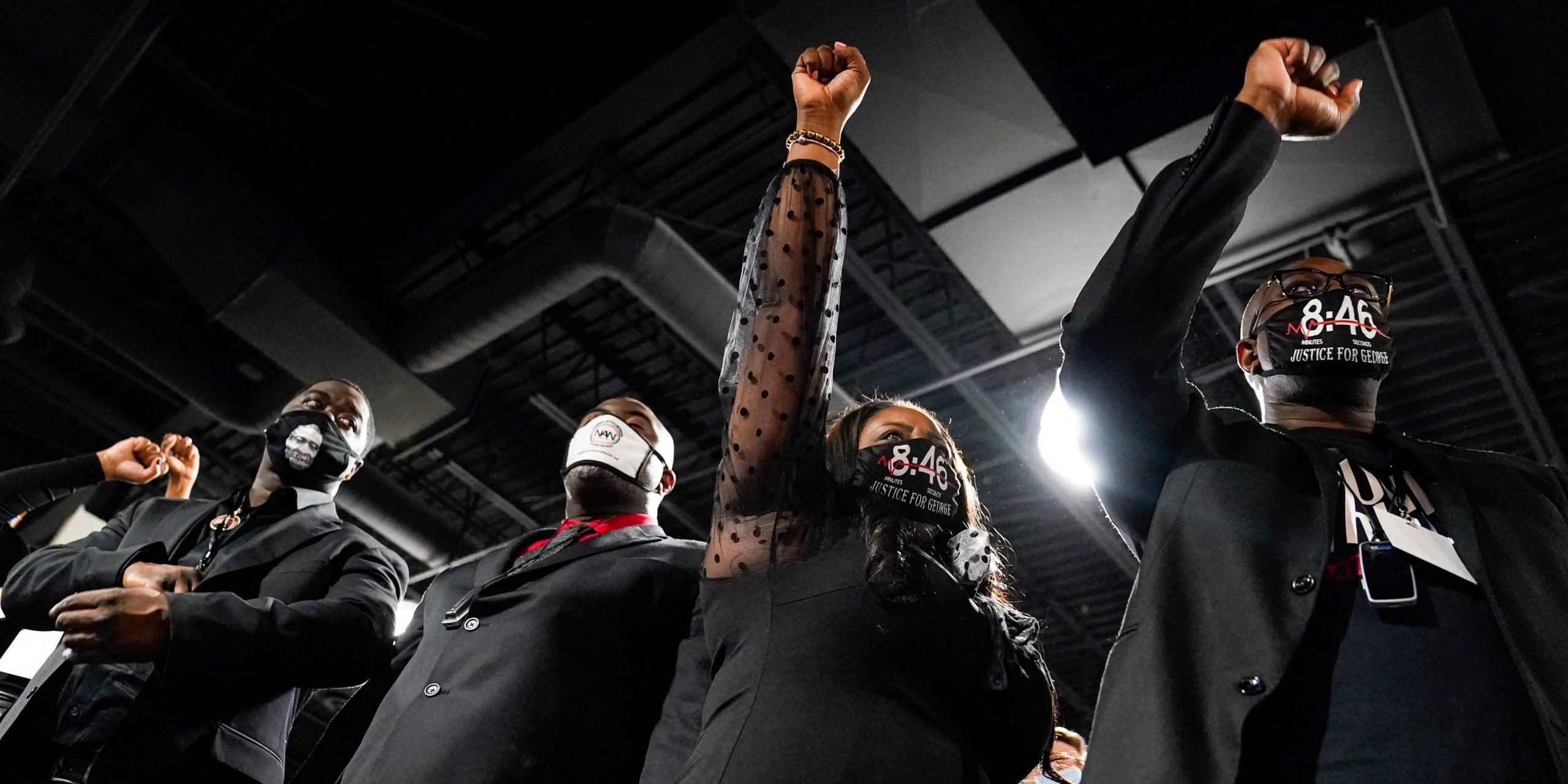 The family of George Floyd salutes Daunte Wright during his funeral services at Shiloh Temple International Ministries in Minneapolis, Thursday, April 22, 2021.