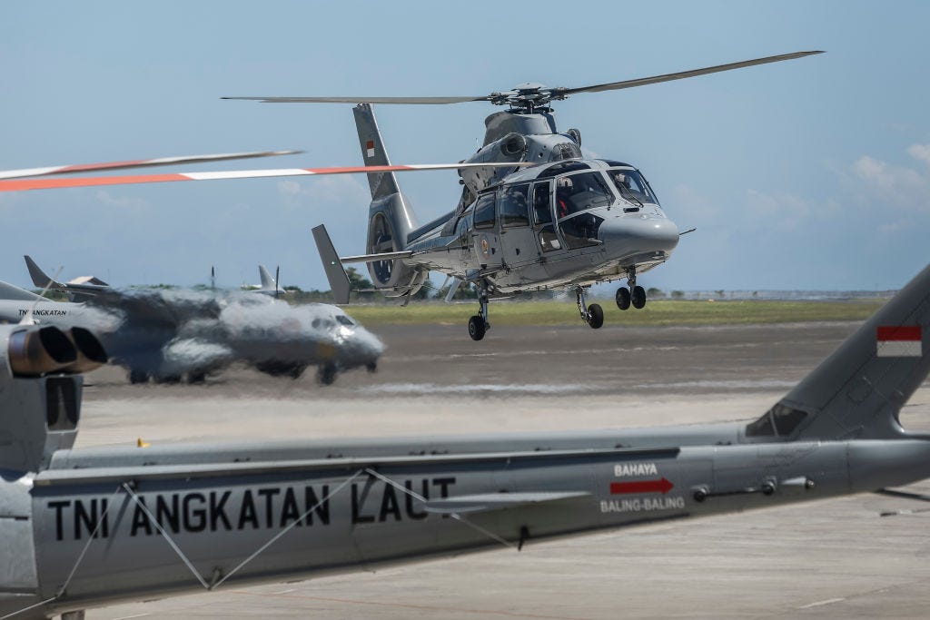 Indonesian navy helicopter land after taking part in search mission for missing Indonesian navy submarine KRI Nanggala 402 at Ngurah Rai Military Air Base in Kuta, Bali, Indonesia on April 23 2021