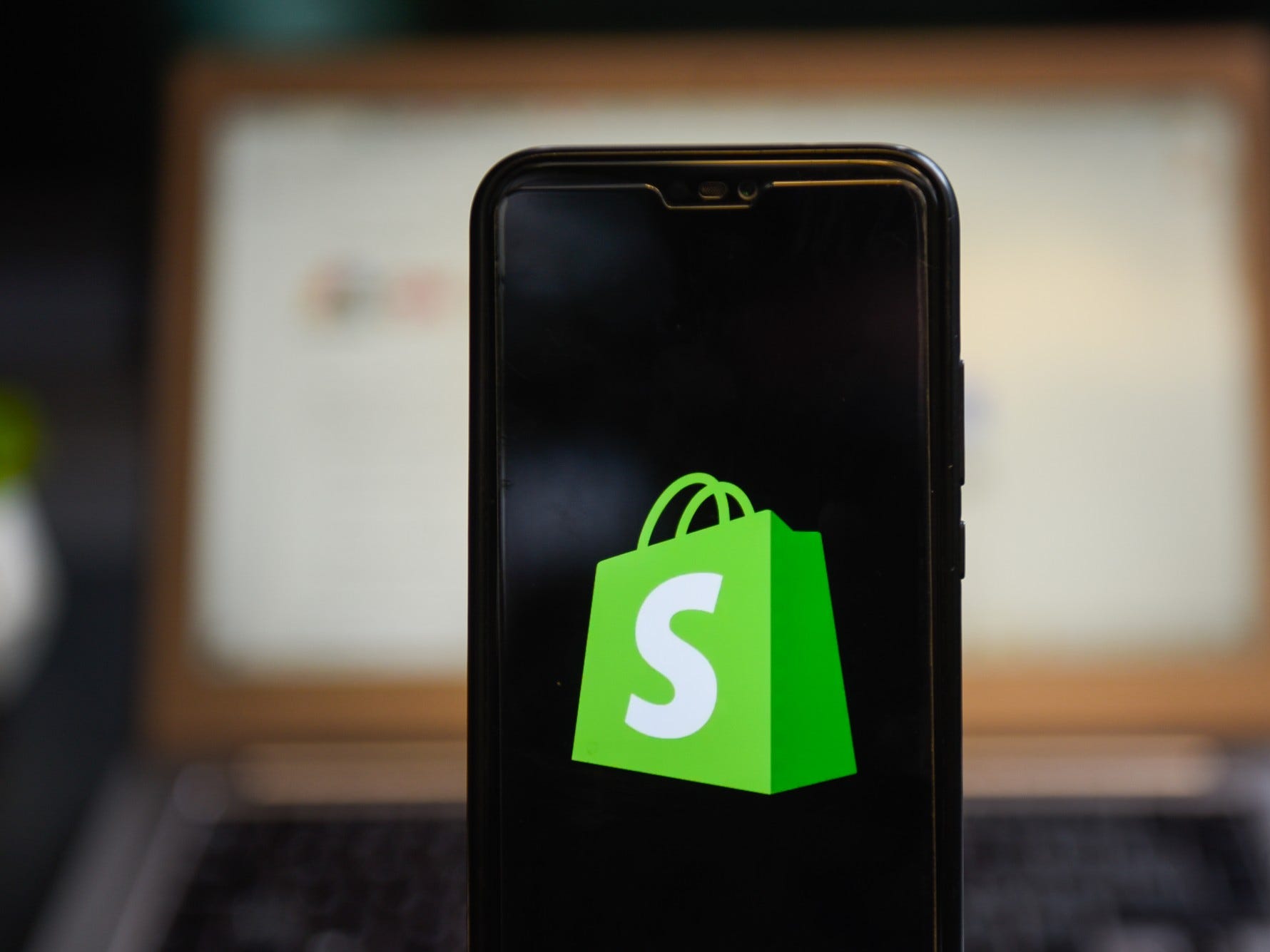 Shopify logo on phone
