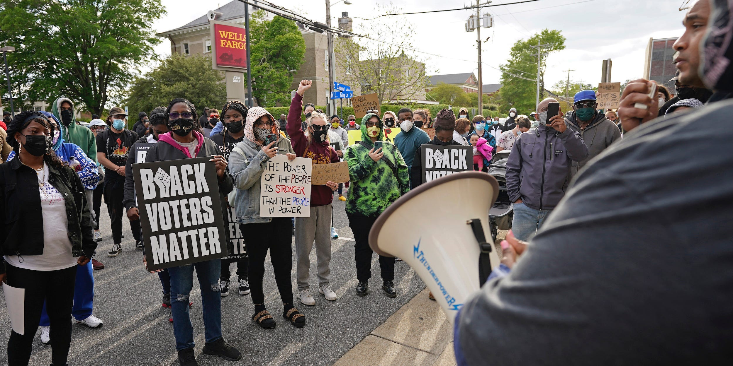 People gather for a peaceful demonstration, Thursday, April 22, 2021, in Elizabeth City, N.C., protesting the shooting of Andrew Brown Jr., 42, by a deputy sheriff trying to serve a search warrant.