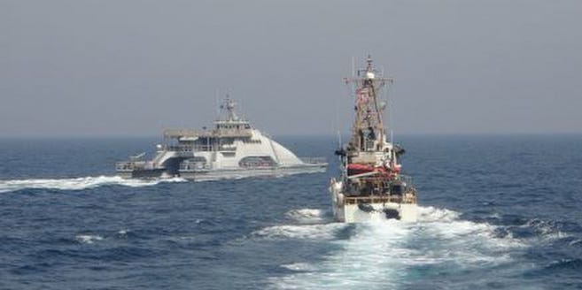 Iran’s Islamic Revolutionary Guard Corps Navy (IRGCN) Harth 55, left, conducted an unsafe and unprofessional action by crossing the bow of the Coast Guard patrol boat USCGC Monomoy (WPB 1326), right, as the U.S. vessel was conducting a routine maritime security patrol in international waters of the southern Arabian Gulf, Apr. 2