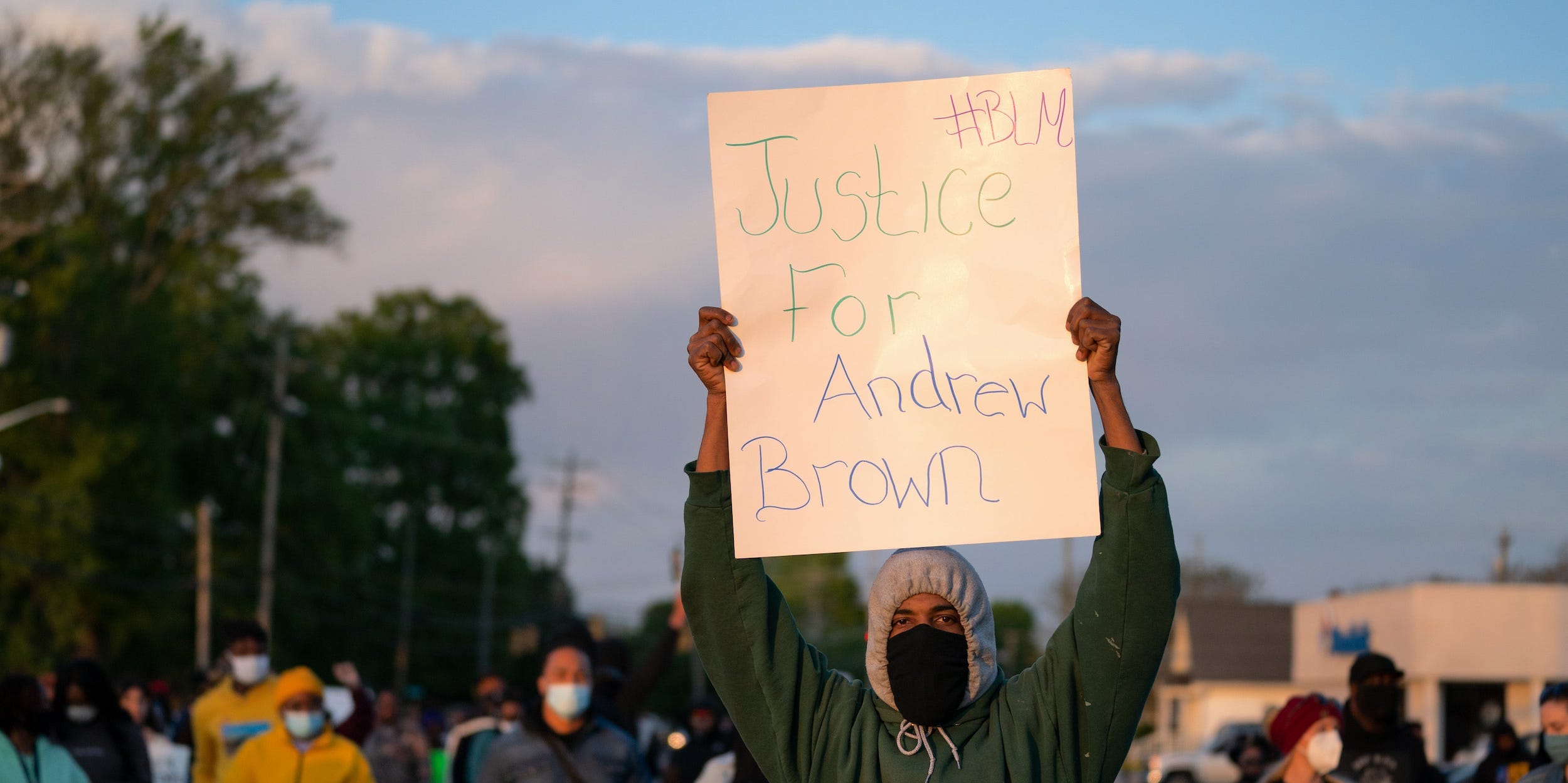 demonstrator holds a sign for Andrew Brown Jr. during a protest march on April 22, 2021 in Elizabeth City, North Carolina. The protest was sparked by the police killing of Brown on April 21.