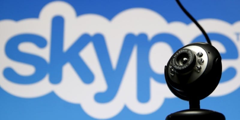 FILE PHOTO: A web camera is seen in front of a Skype logo in this photo illustration May 26, 2015. REUTERS/Dado Ruvic/File Photo