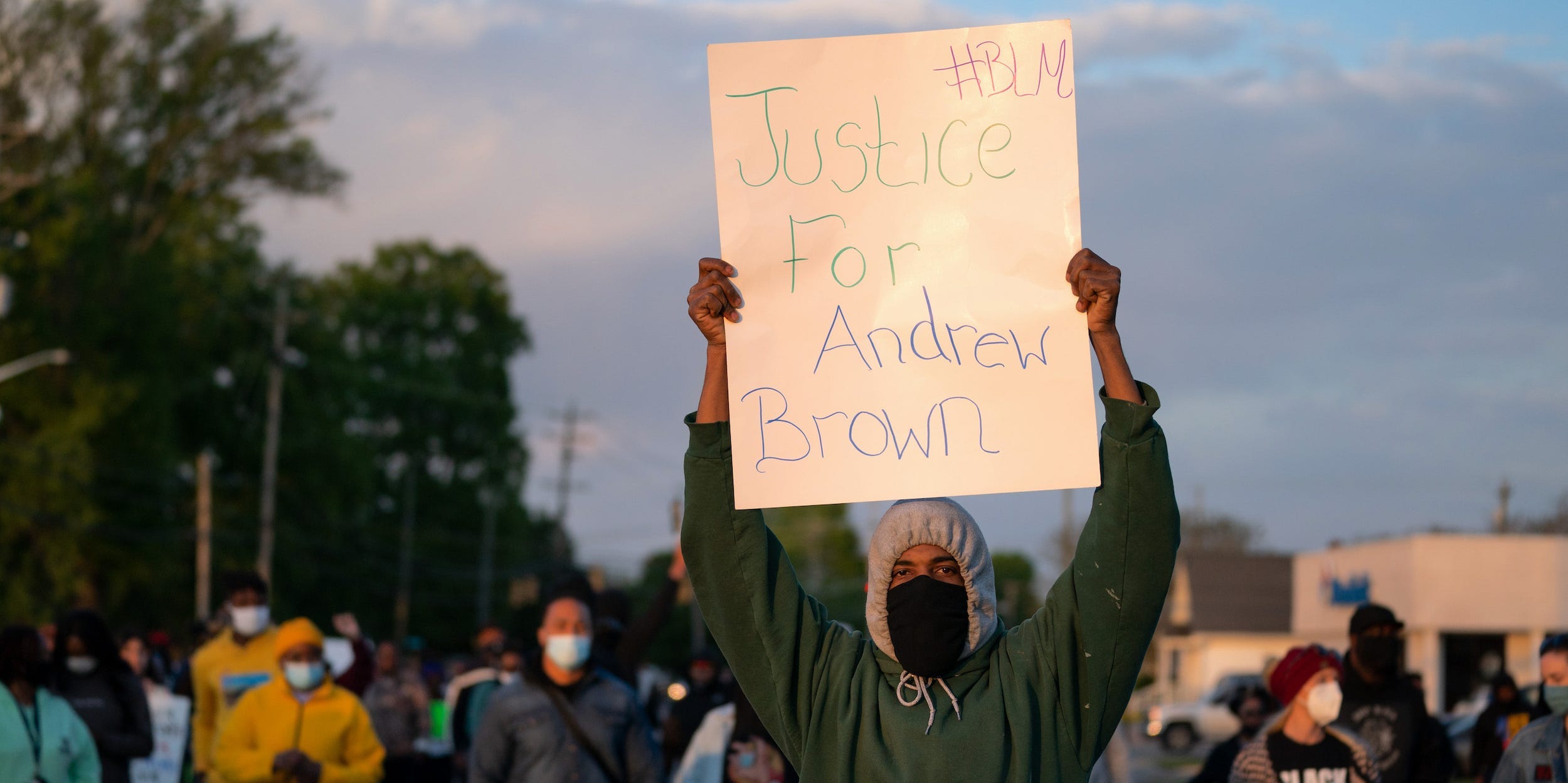 demonstrator holds a sign for Andrew Brown Jr. during a protest march on April 22, 2021 in Elizabeth City, North Carolina. The protest was sparked by the police killing of Brown on April 21.