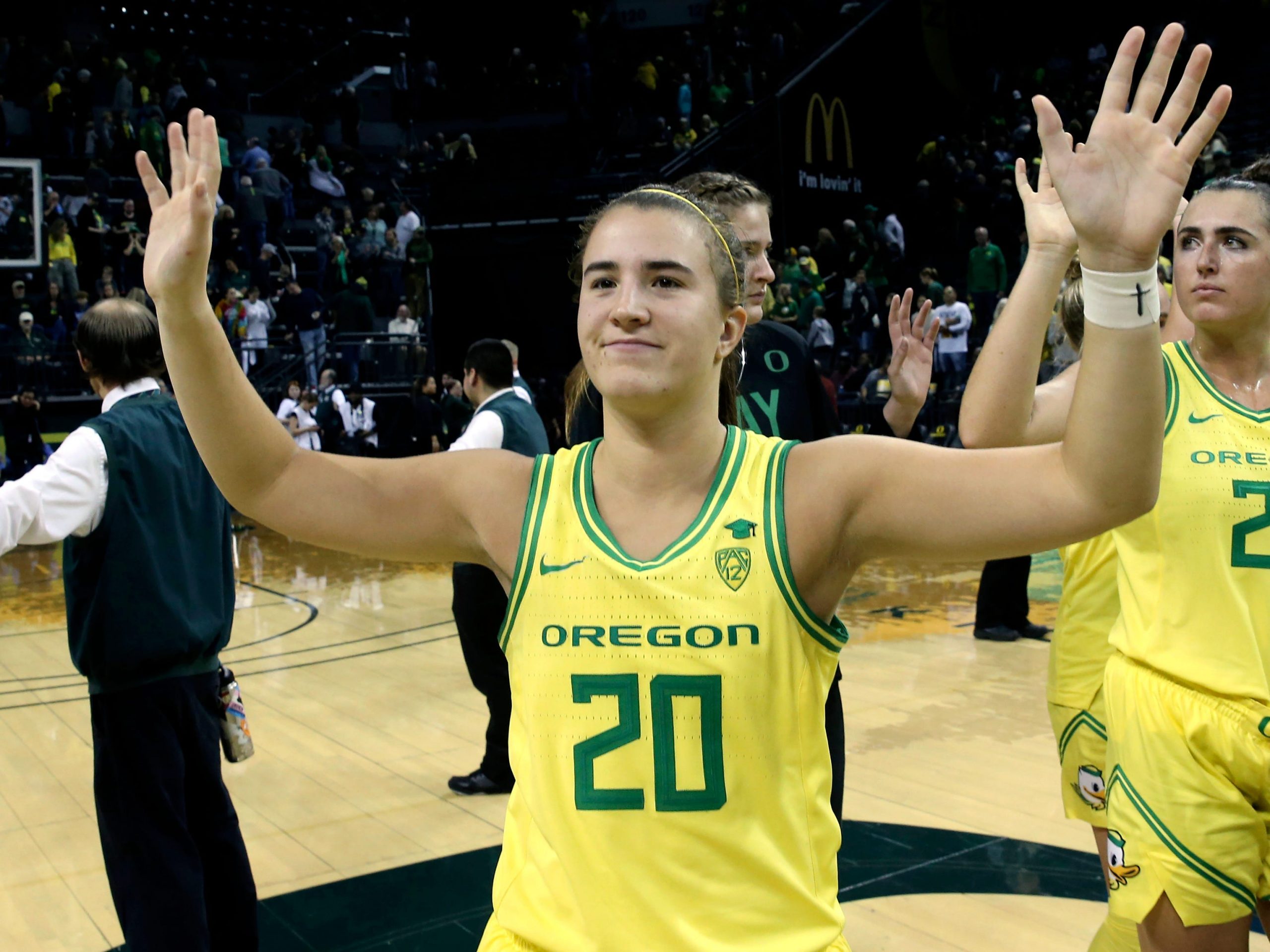 FILE - In this Nov. 16, 2019, file photo, Oregon's Sabrina Ionescu acknowledges the crowd with teammates after an NCAA college basketball game against Texas Southern in Eugene, Ore. Ionescu capped off a unprecedented college career by entering an exclusive club. Oregon's star guard was a unanimous choice Monday, March 23, 2020, as The Associated Press women's basketball player of the year. She was only the second player ever to the lone recipient of votes, joining Breanna Stewart, since the award was first given in 1995. (AP Photo/Chris Pietsch, FIle)