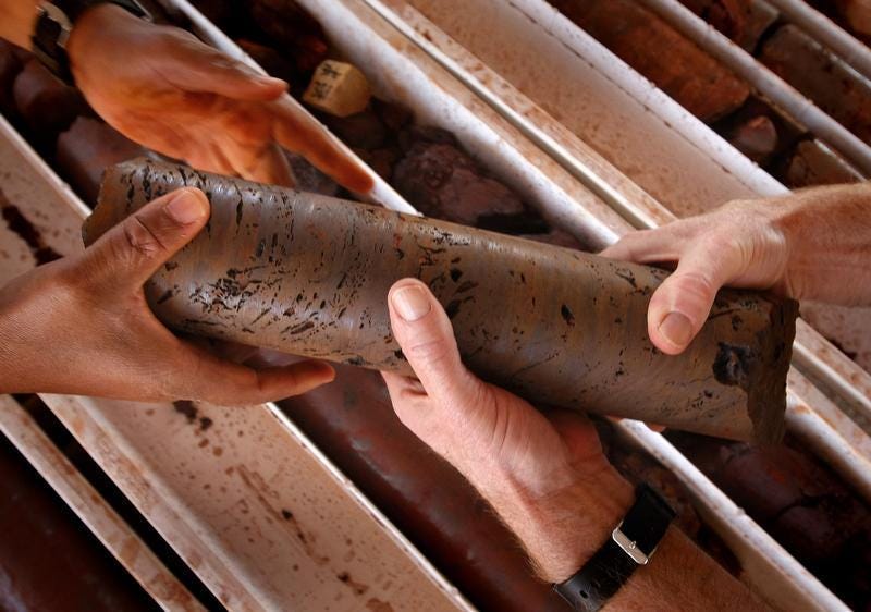 An iron ore core sample is handled at a prospective mine near Port Hedland, Australia, May 26, 2008. REUTERS/Tim Wimborne"