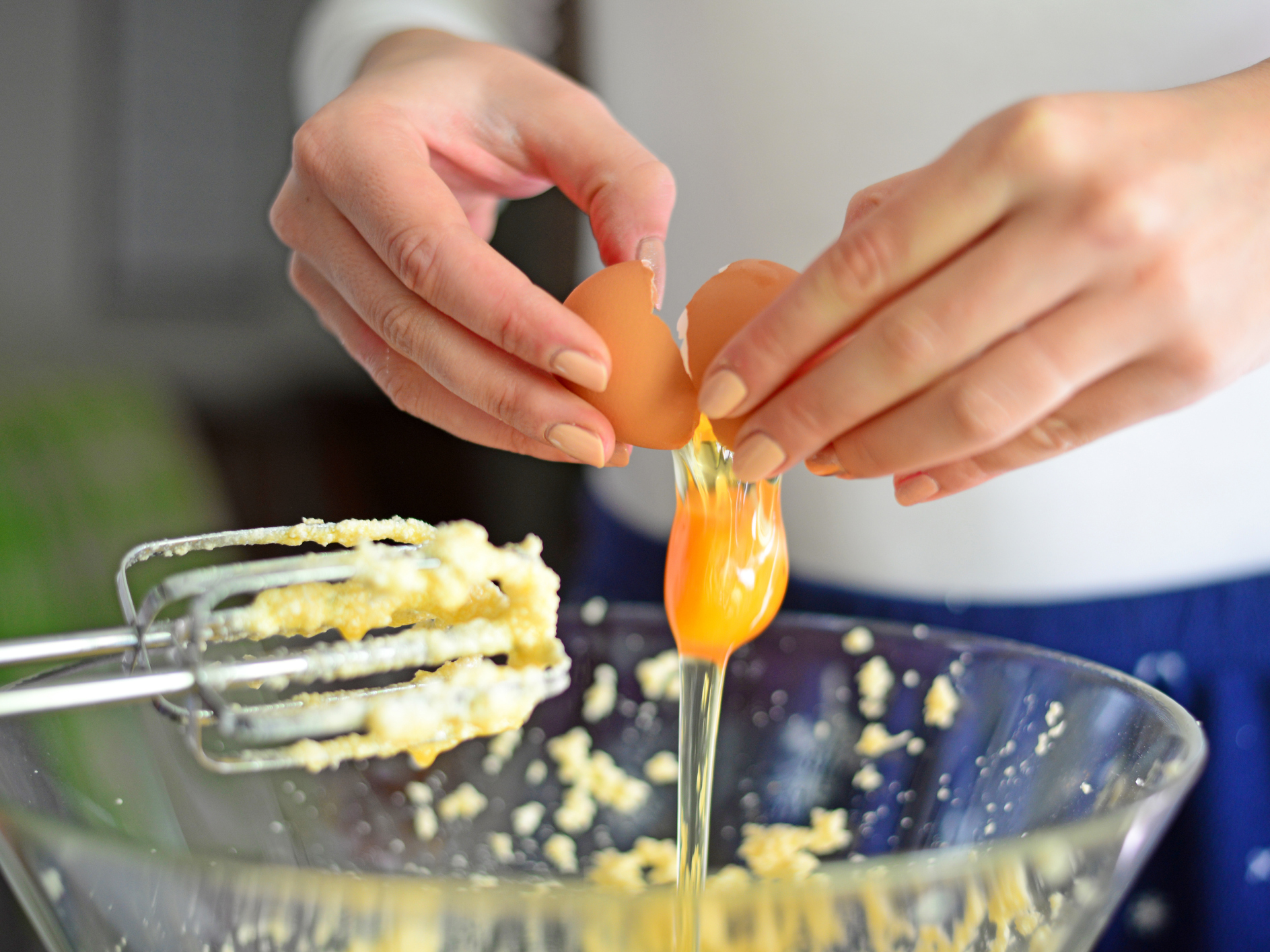 cracking an egg baking