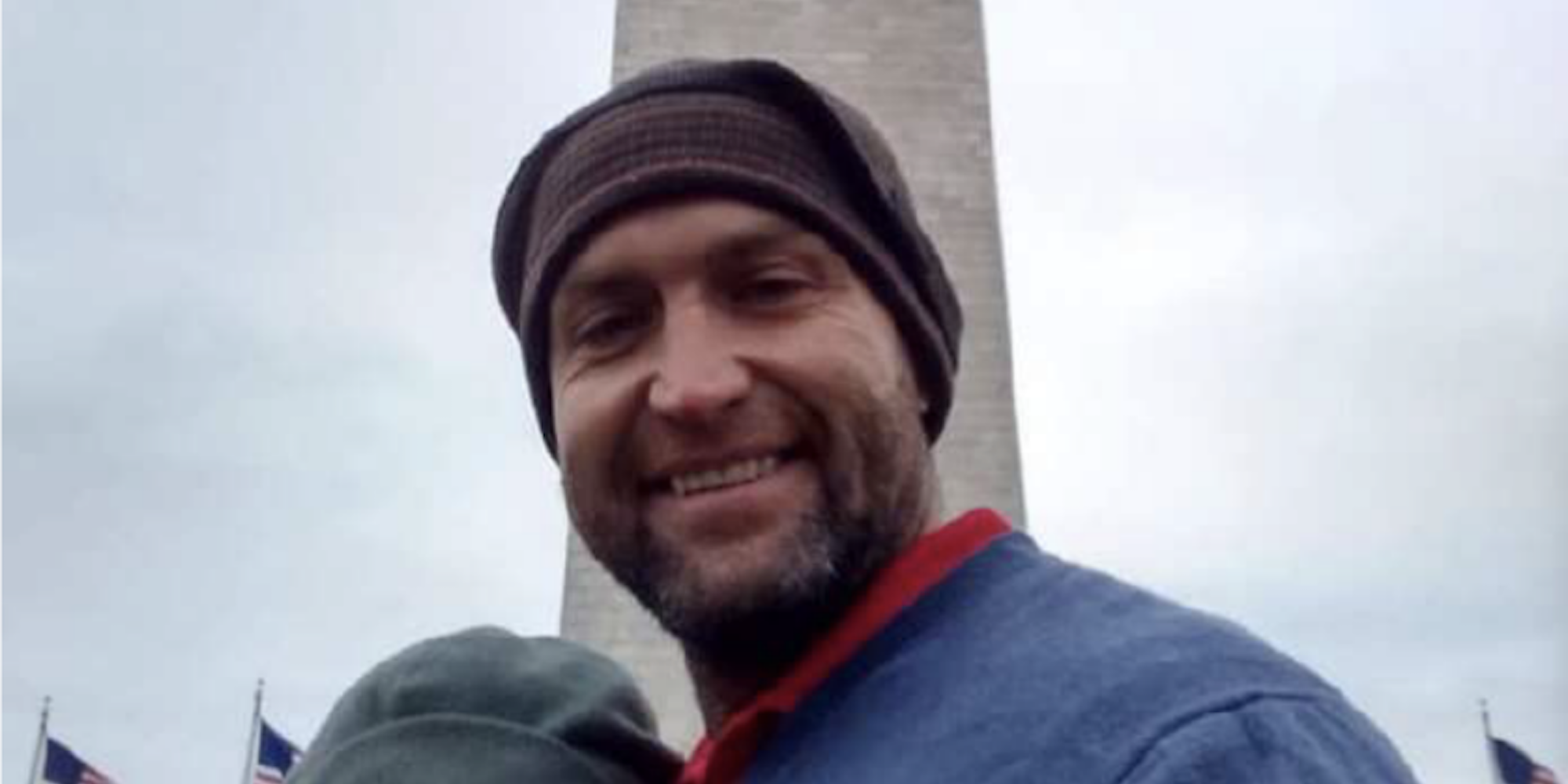 Landon Copeland posing in front of the Washington Monument with a woman, whose face has been blocked out by the FBI.