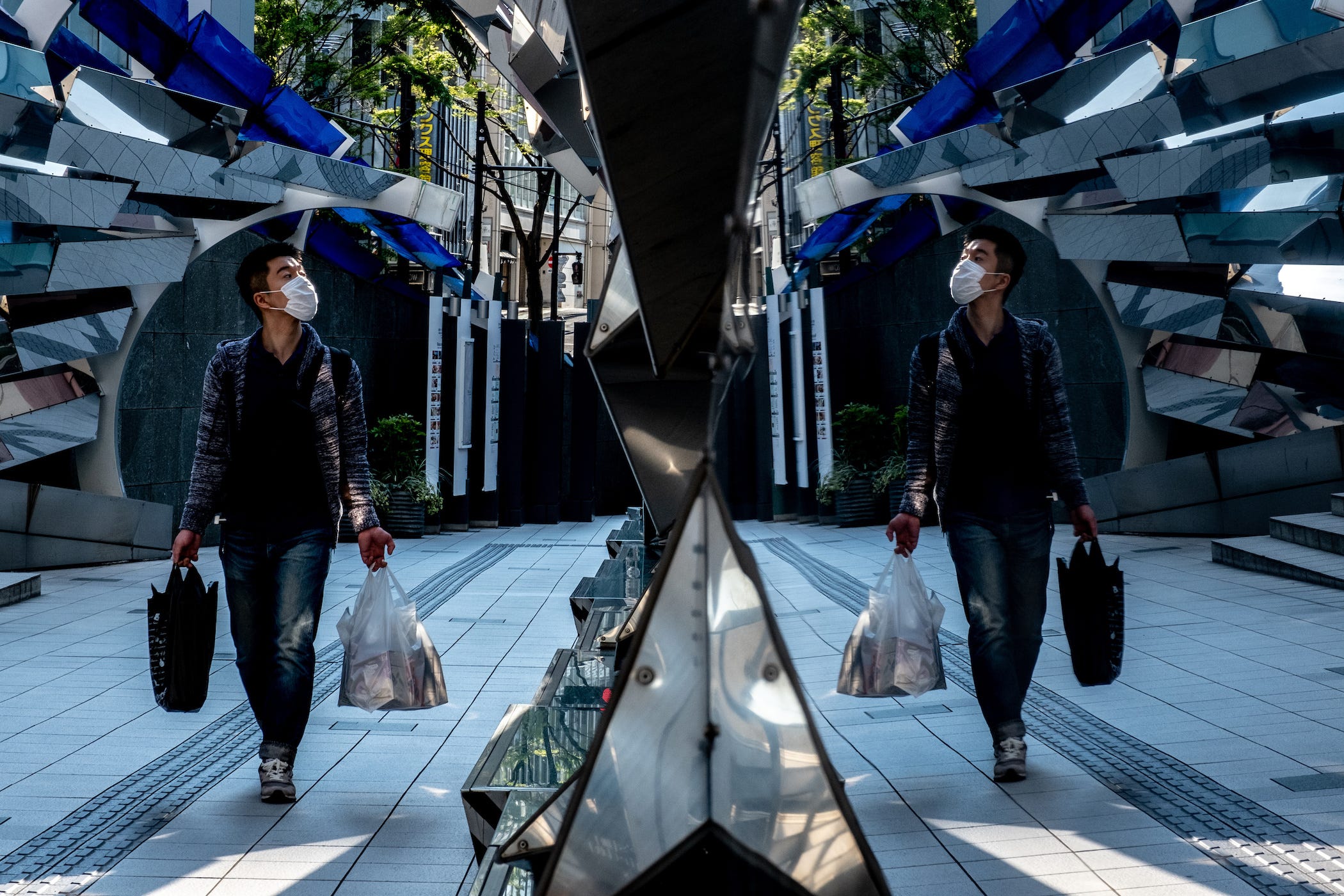 A man walks through a closed shopping mall in Shibuya, Tokyo on April 29, 2021.