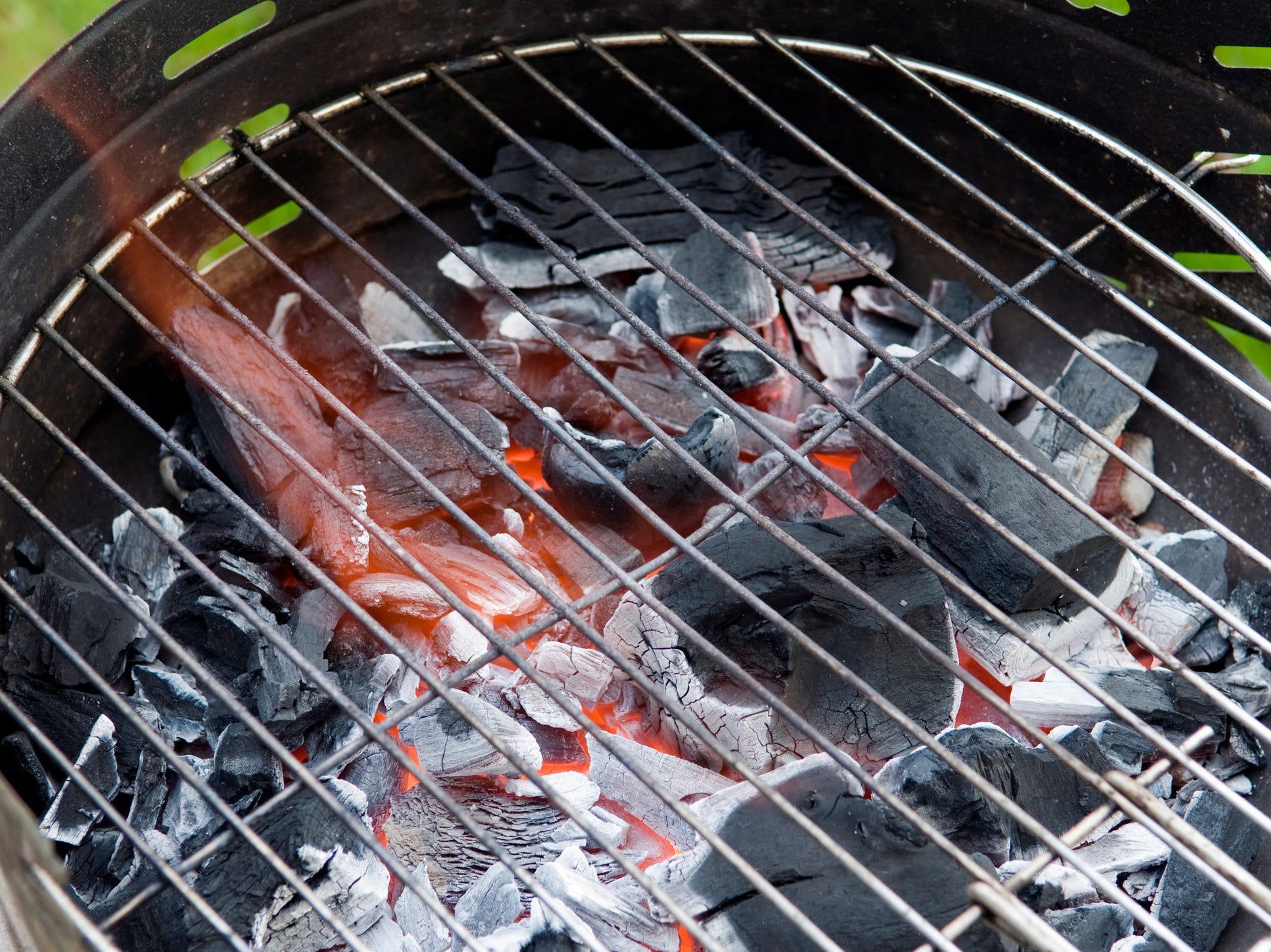 Charcoal grill with burning coals