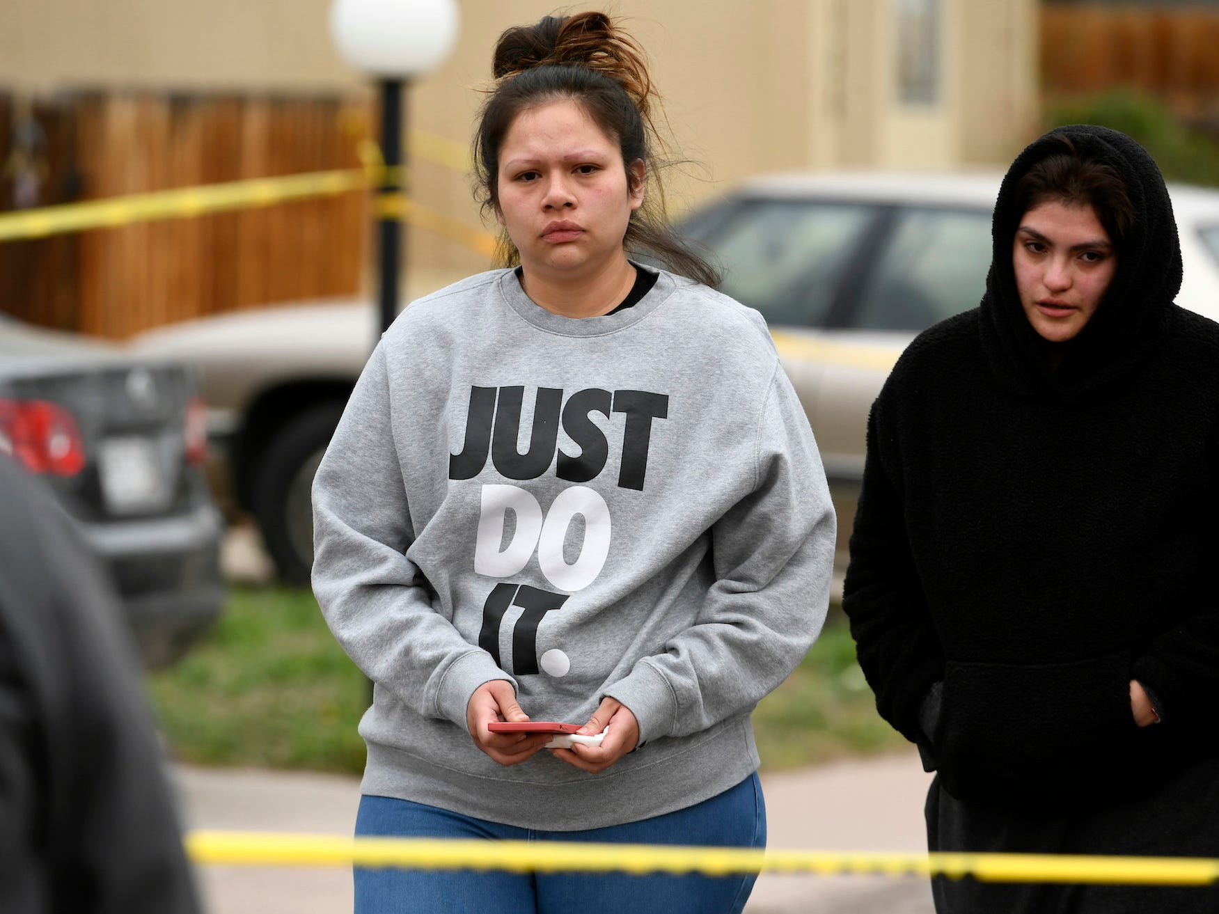 Nubia Marquez, center, whose mother was one of six shooting victims, walks away from the scene of the shooting at the Canterbury Mobile Home Park on May 9, 2021 in Colorado Springs, Colorado.