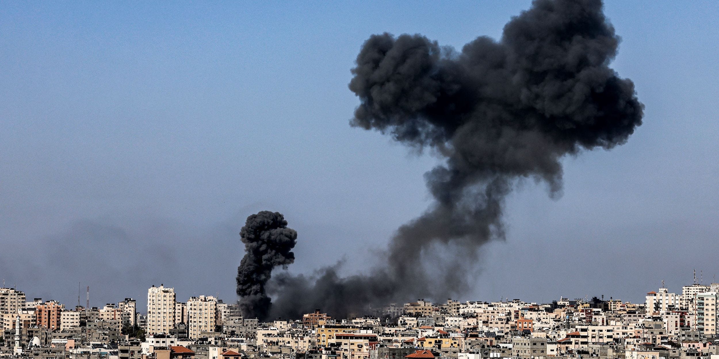 Smoke billows following Israeli airstrikes on Gaza City on May 12, 2021, amid the most intense Israeli-Palestinian hostilities in seven years.