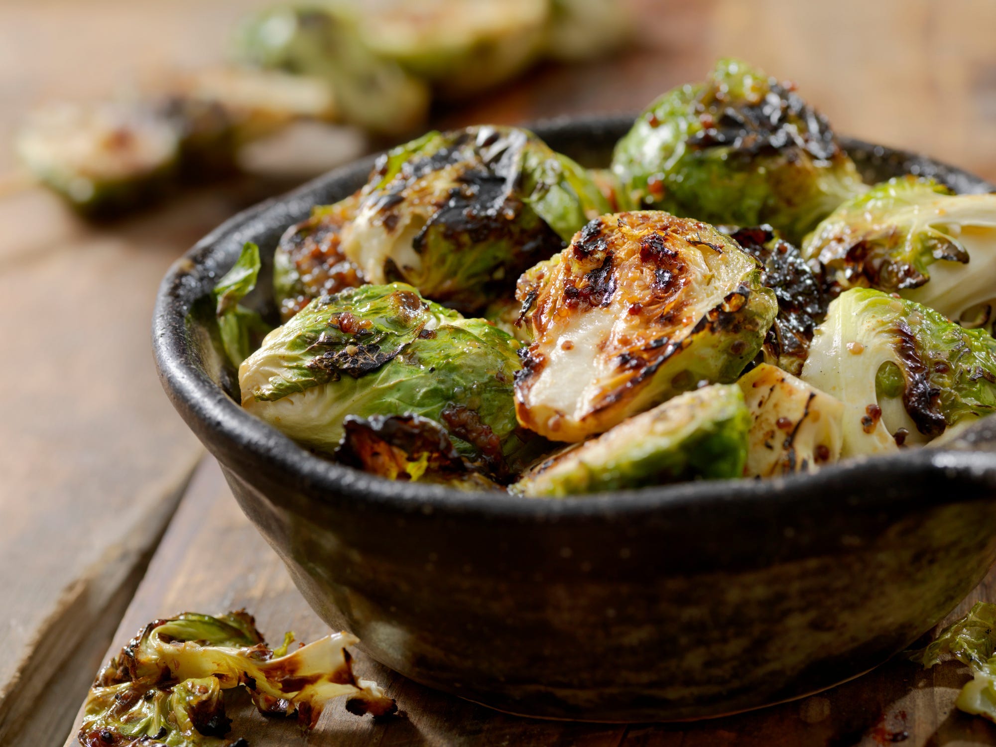 A bowl of glazed grilled Brussels sprouts