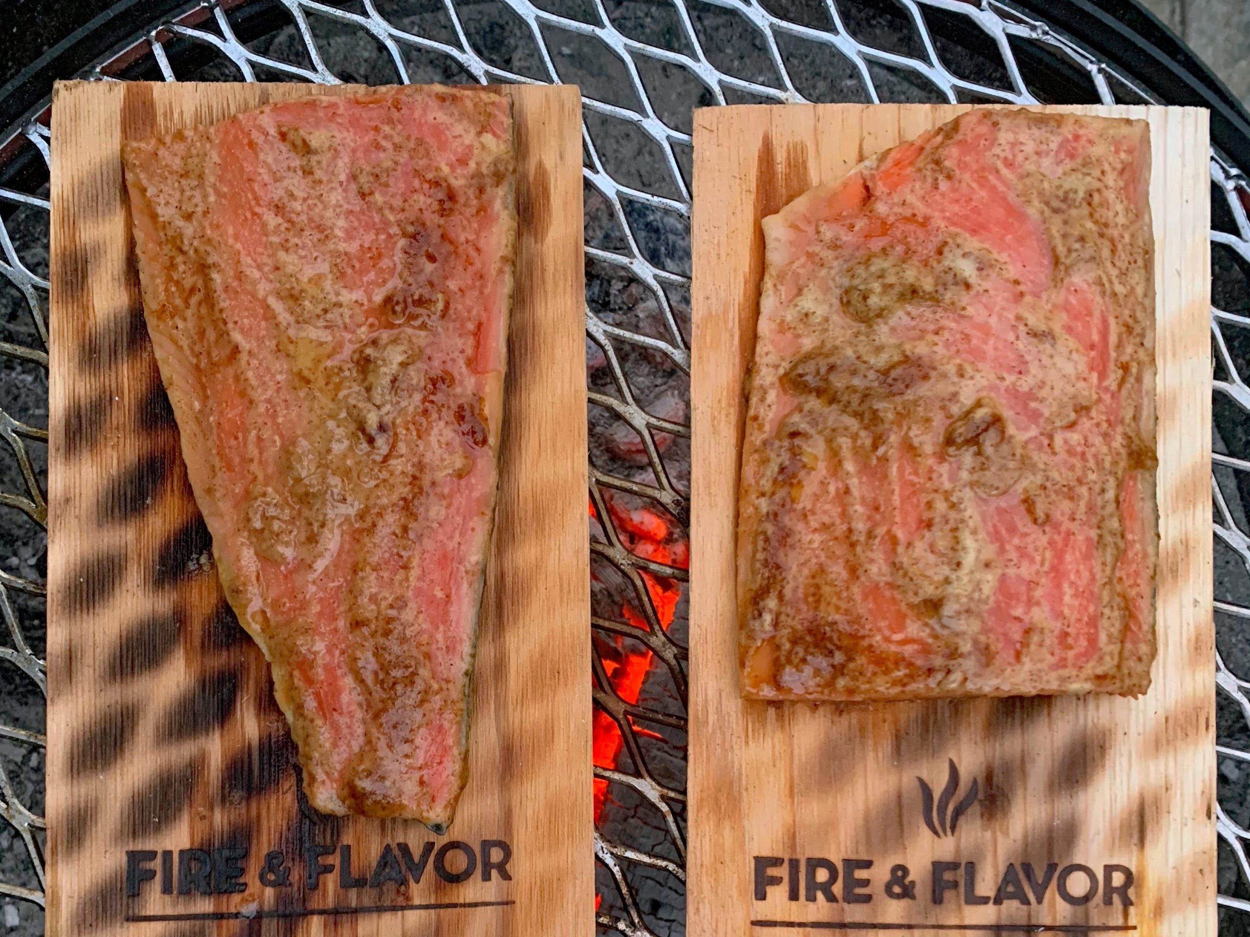 Cedar plank salmon on a charcoal grill