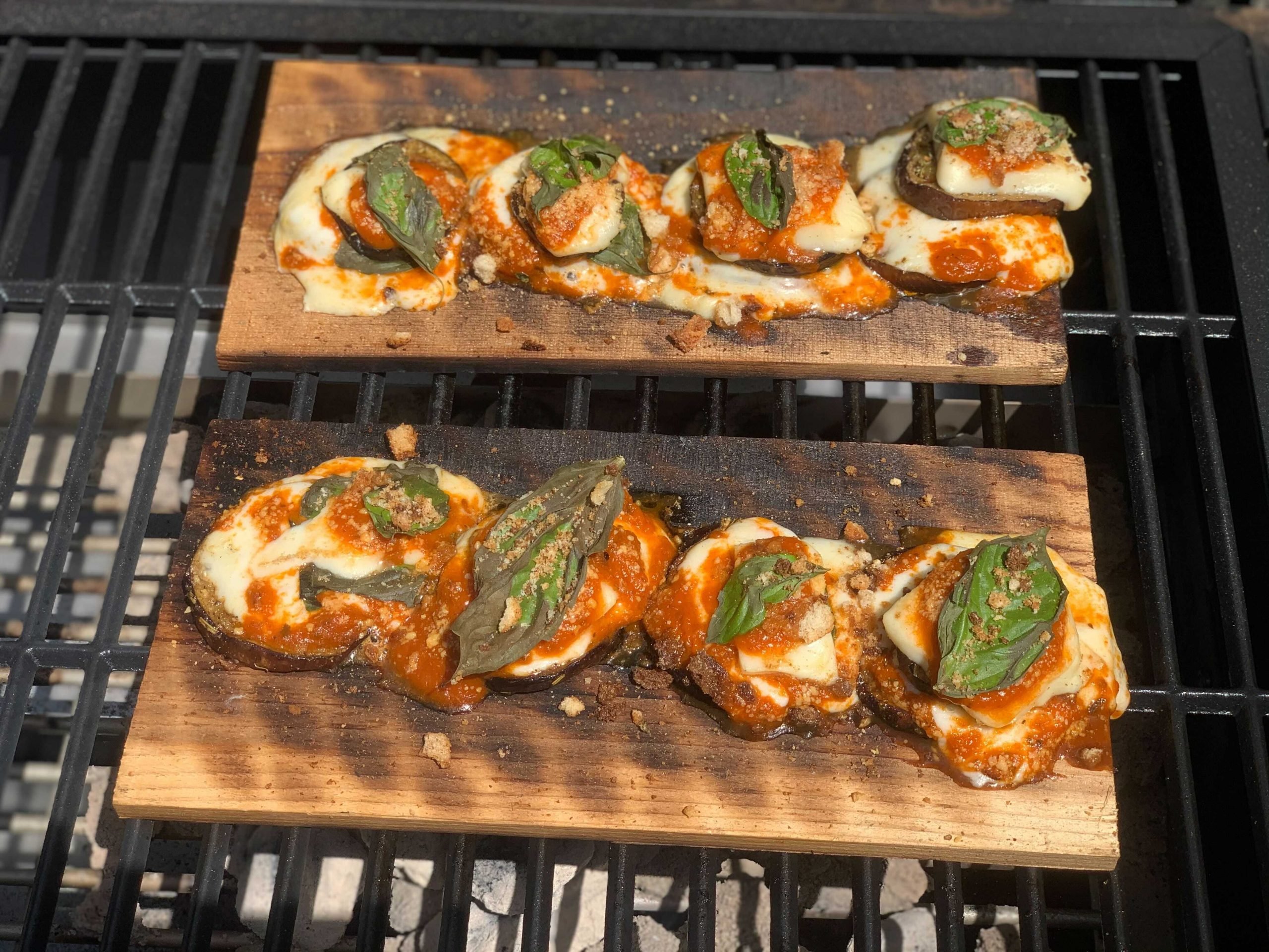 Eggplant parmigiana on a cedar plank on the grill