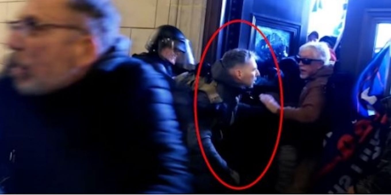Major Christopher Warnagiris seen circled at the Capitol insurrection.