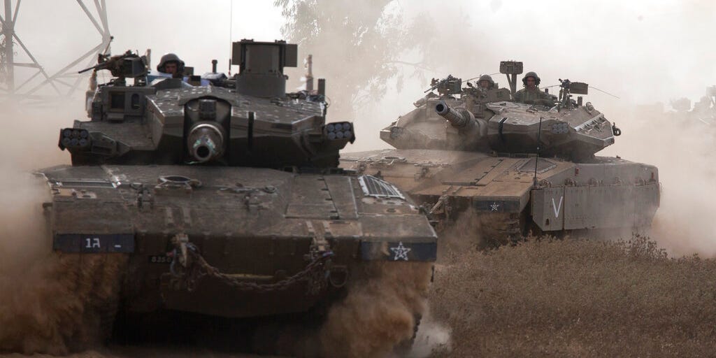 Israeli tanks are on the move near Israel and Gaza border, Friday, July 18, 2014