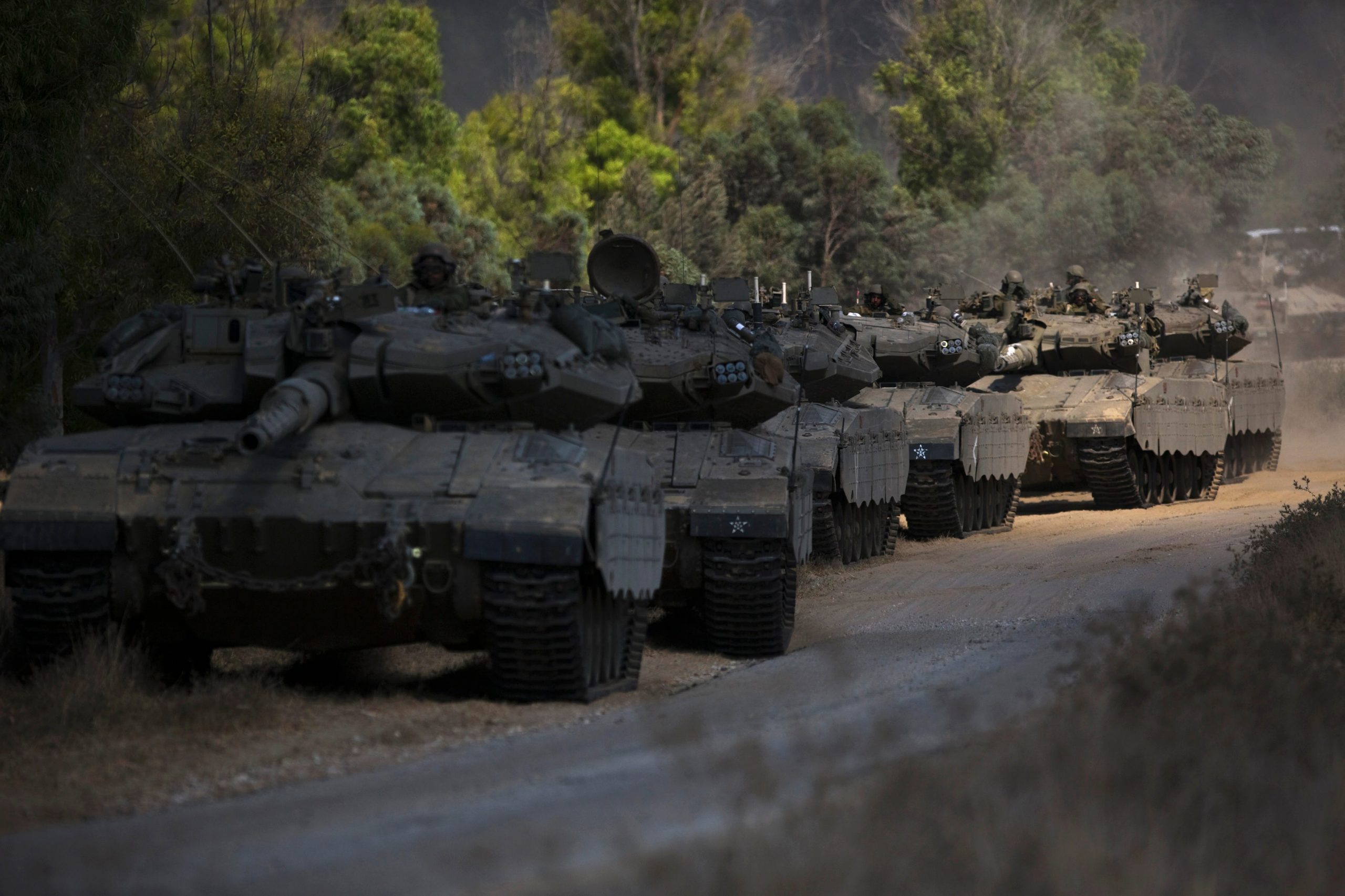 An Israeli armored convoy maneuvers outside central Gaza Strip July 19, 2014
