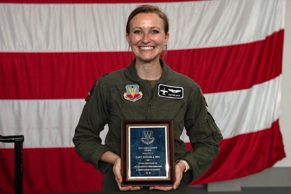 Capt. Taylor Bye, 75th Fighter Squadron pilot and chief of standardization and evaluation, poses for a photo after receiving the Air Combat Command Airmanship Award at Moody Air Force Base, Georgia, May 5, 2021.