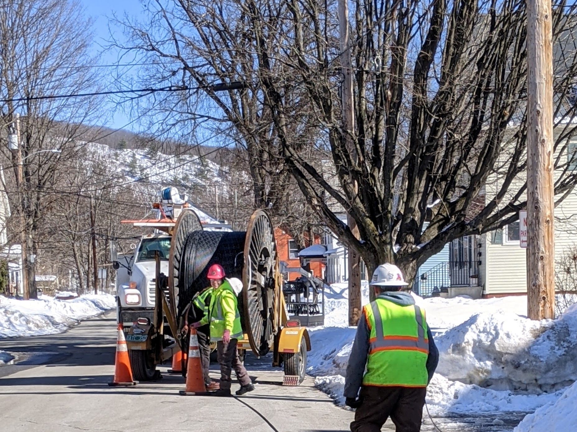 Workers hanging fiber optic cables in Brattleboro. Alex Lockie