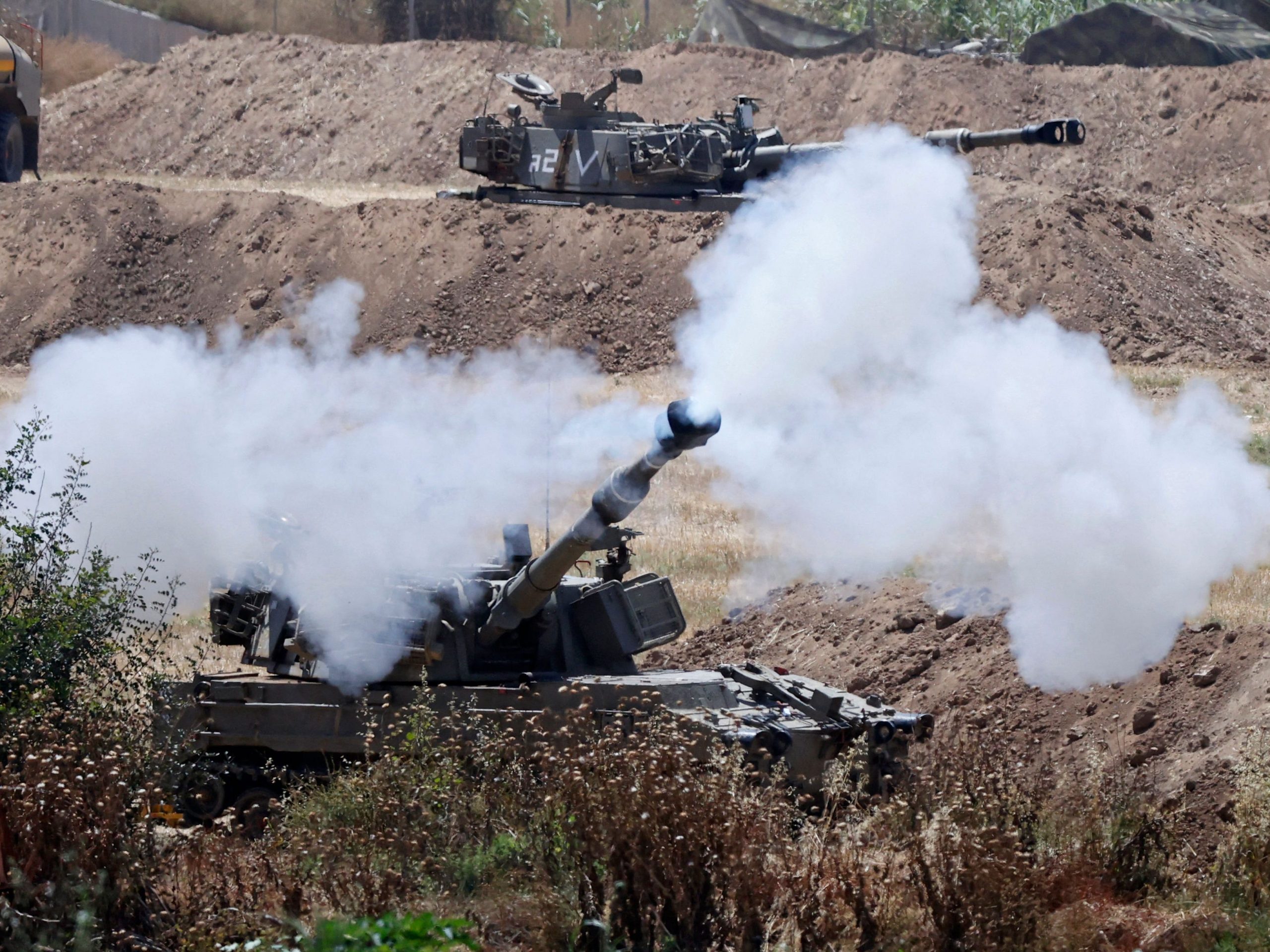 Israeli tank fires a howitzer