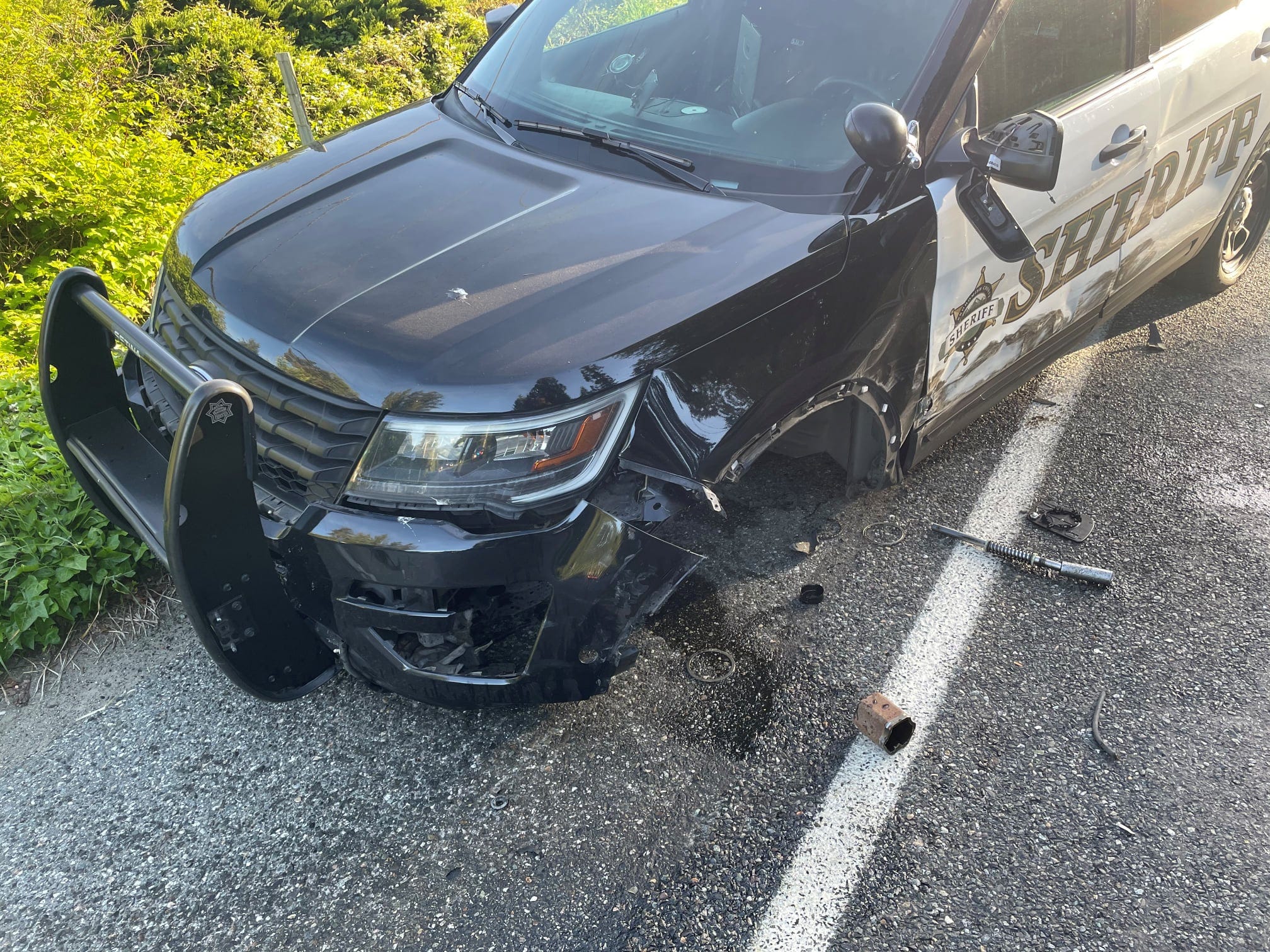 A deputy's vehicle has significant damage from a Tesla on Autopilot crashing into it