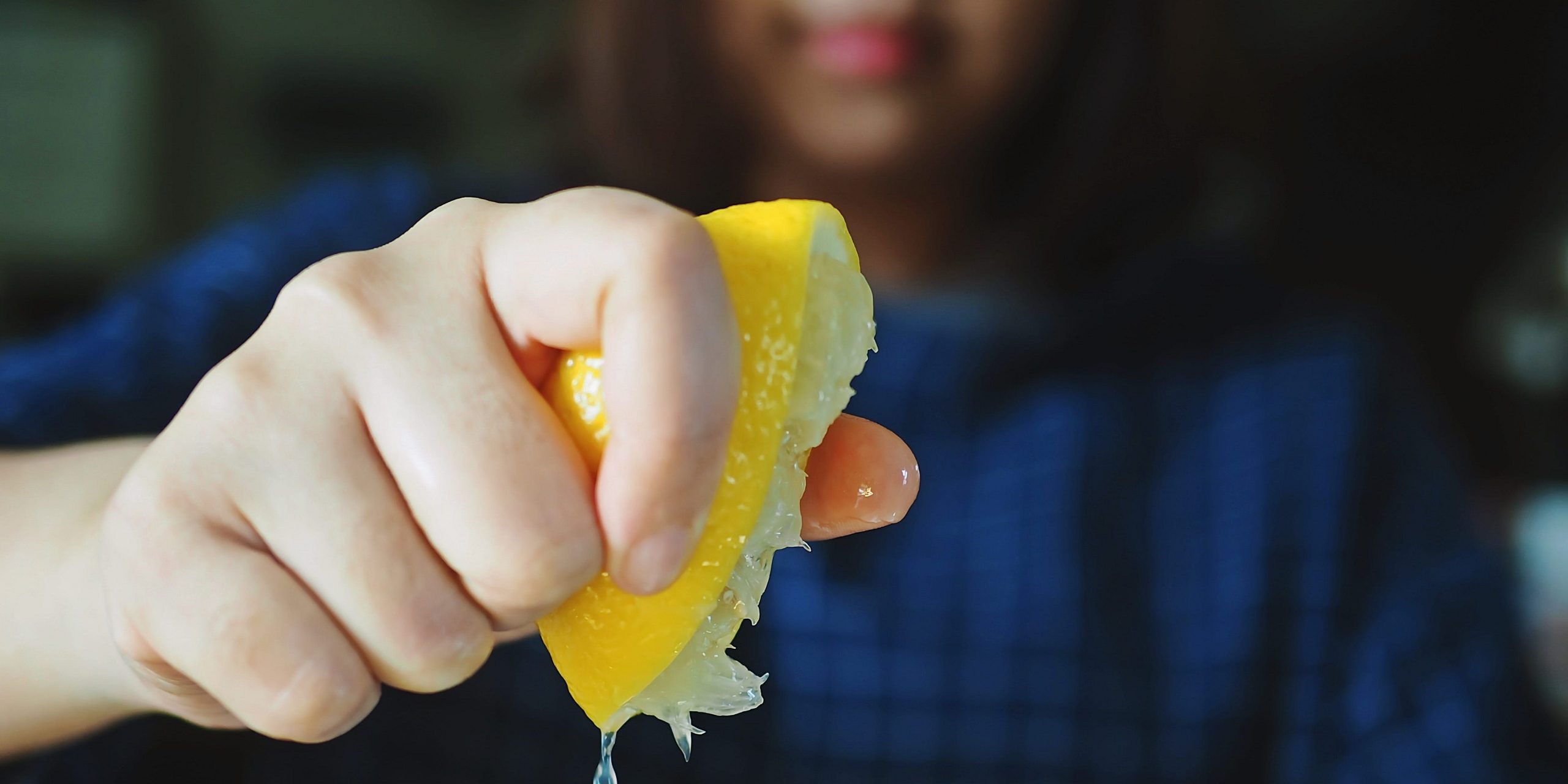 lemon woman squeezing lemon