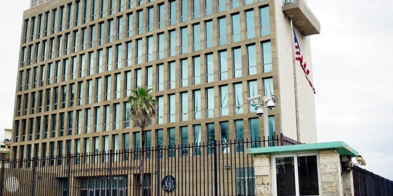 FILE PHOTO: People walk past the U.S. Embassy in Havana, Cuba, June 19, 2017. REUTERS/Alexandre Meneghini