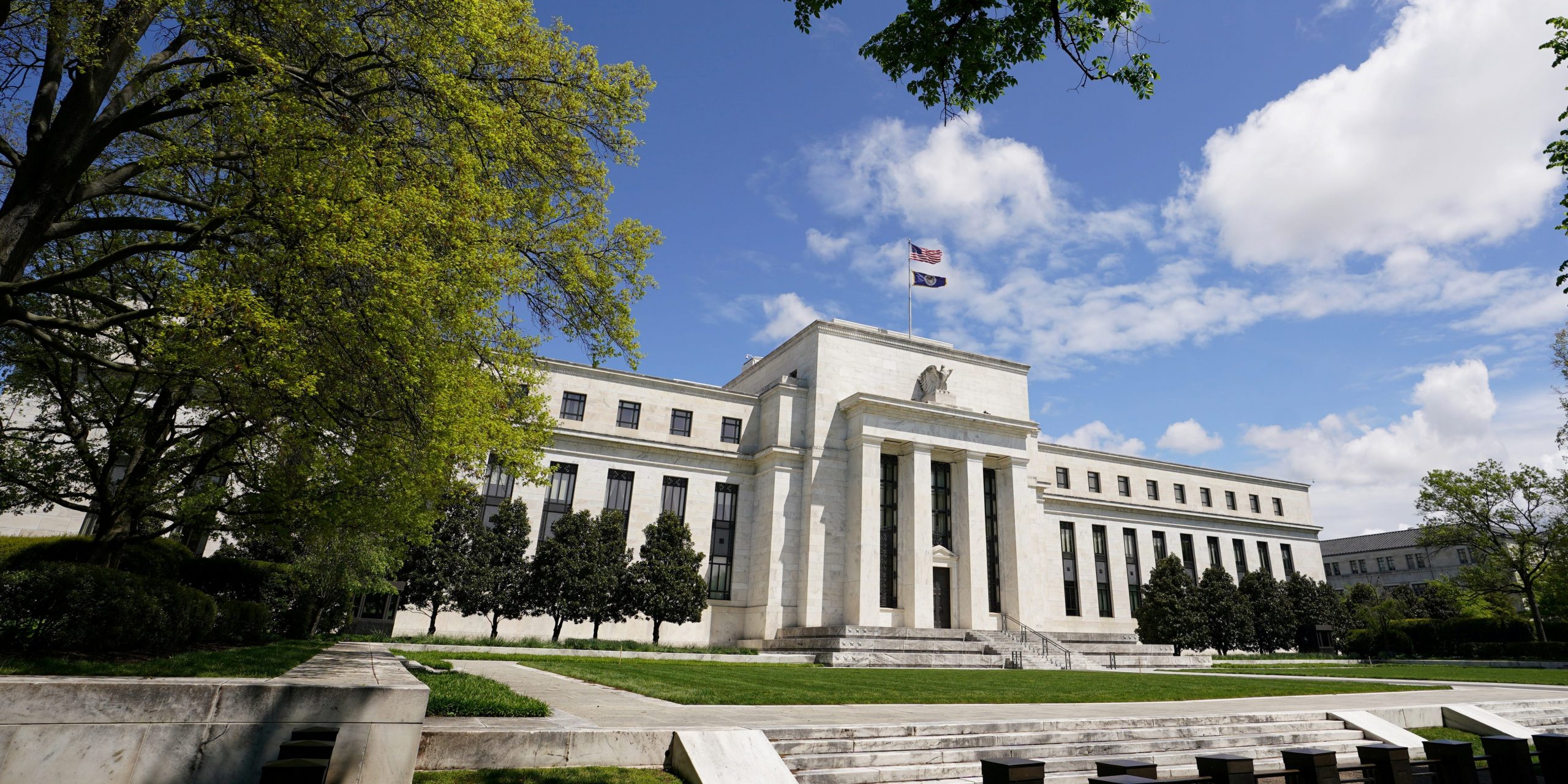 FILE PHOTO: The U.S. Federal Reserve building is set against a blue sky amid the coronavirus pandemic in Washington, U.S., May 1, 2020. REUTERS/Kevin Lamarque