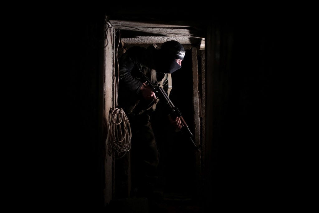 An armed Izz ad-Din al-Qassam Brigade, military wing of Hamas, deploys at a tunnel in Shujaya neighborhood of Gaza City, Gaza on August 17, 2014