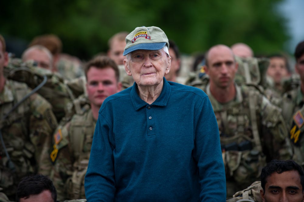 Retired U.S. Army Col. Ralph Puckett stands along side troops as they prepare to start a foot march during the 2021 David E. Grange Jr. Best Ranger Competition (BRC) on Fort Benning, Ga., April 16, 2021