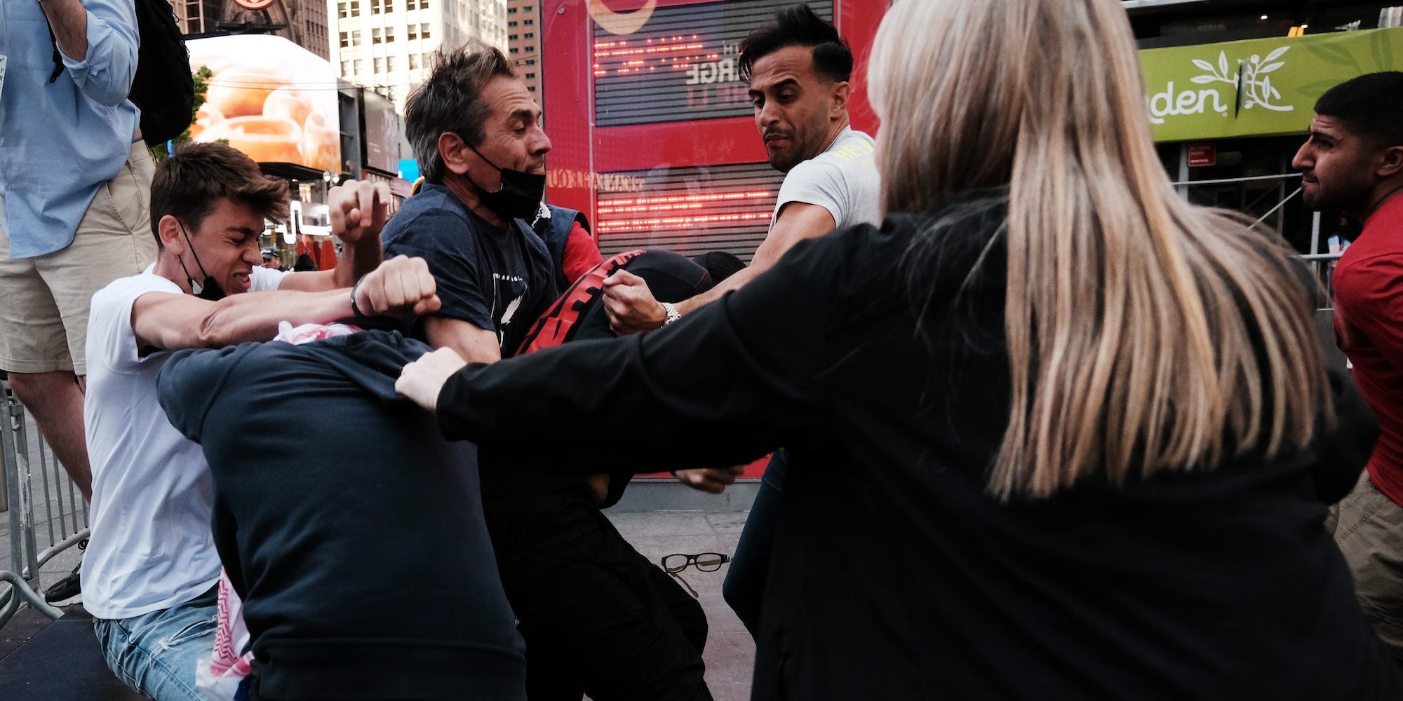 Pro Palestinian and pro Israeli protesters face off in a violent clash in Times Square on May 20, 2021 in New York City.