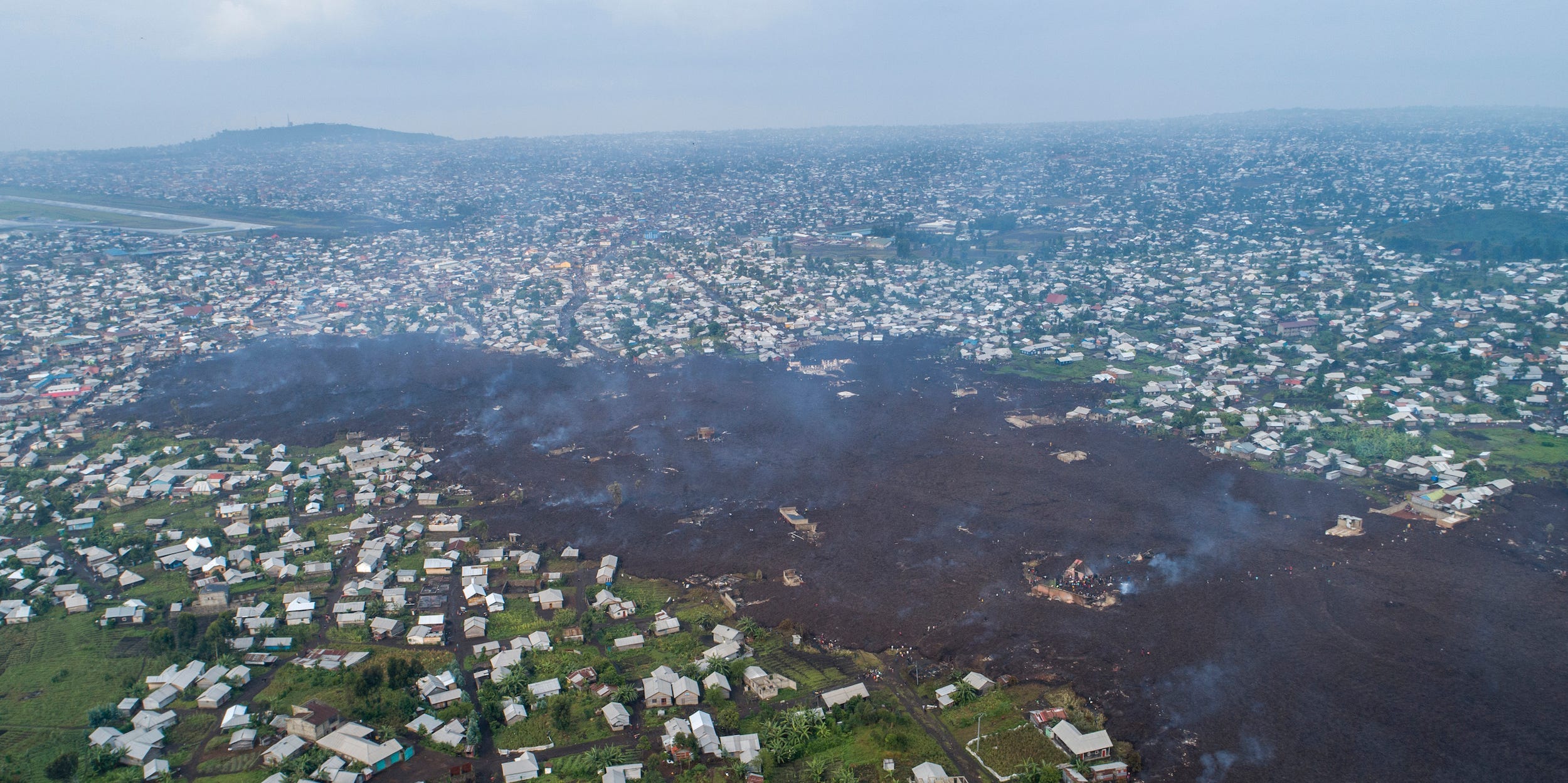 Lava from the eruption of Mount Nyiragongo cuts through Buhene north of Goma, Congo Monday, May 24, 2021.