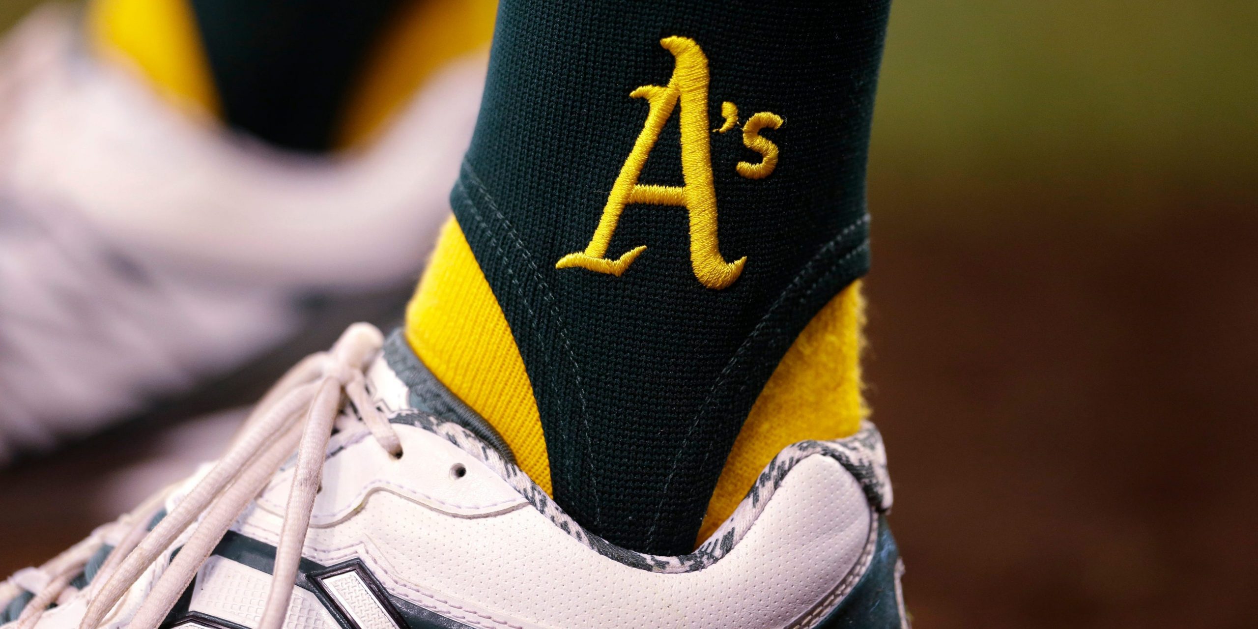 The logo for the Oakland Athletics is seen stitched onto a pair of socks during a baseball game against the Seattle Mariners Sunday, Sept. 29, 2013, in Seattle.