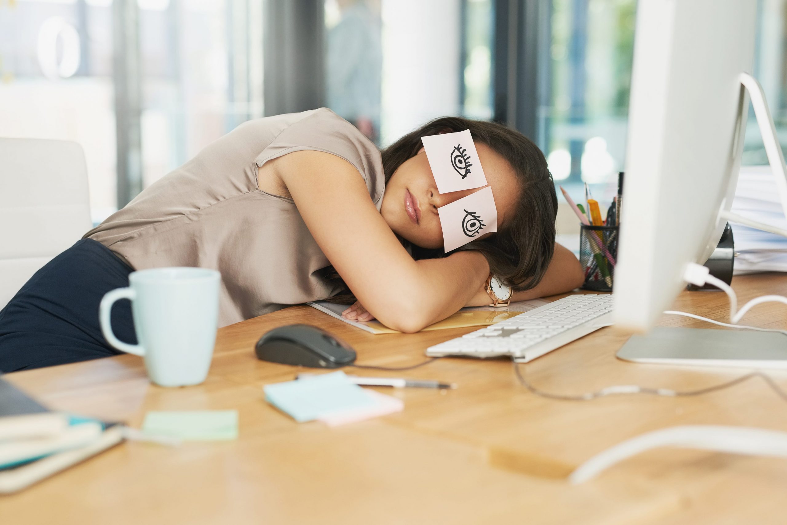 woman napping at desk