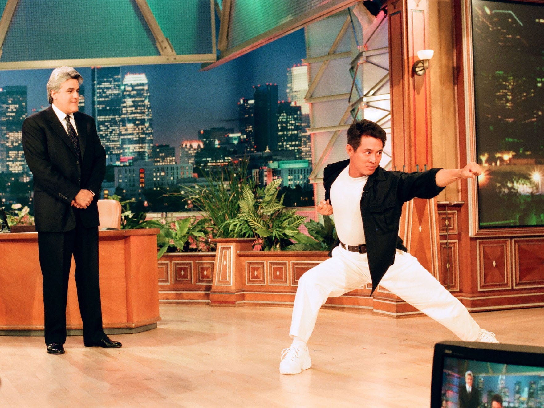 Jay Leno watches as Jet Li peforms a martial arts demonstration on July 16, 1998.