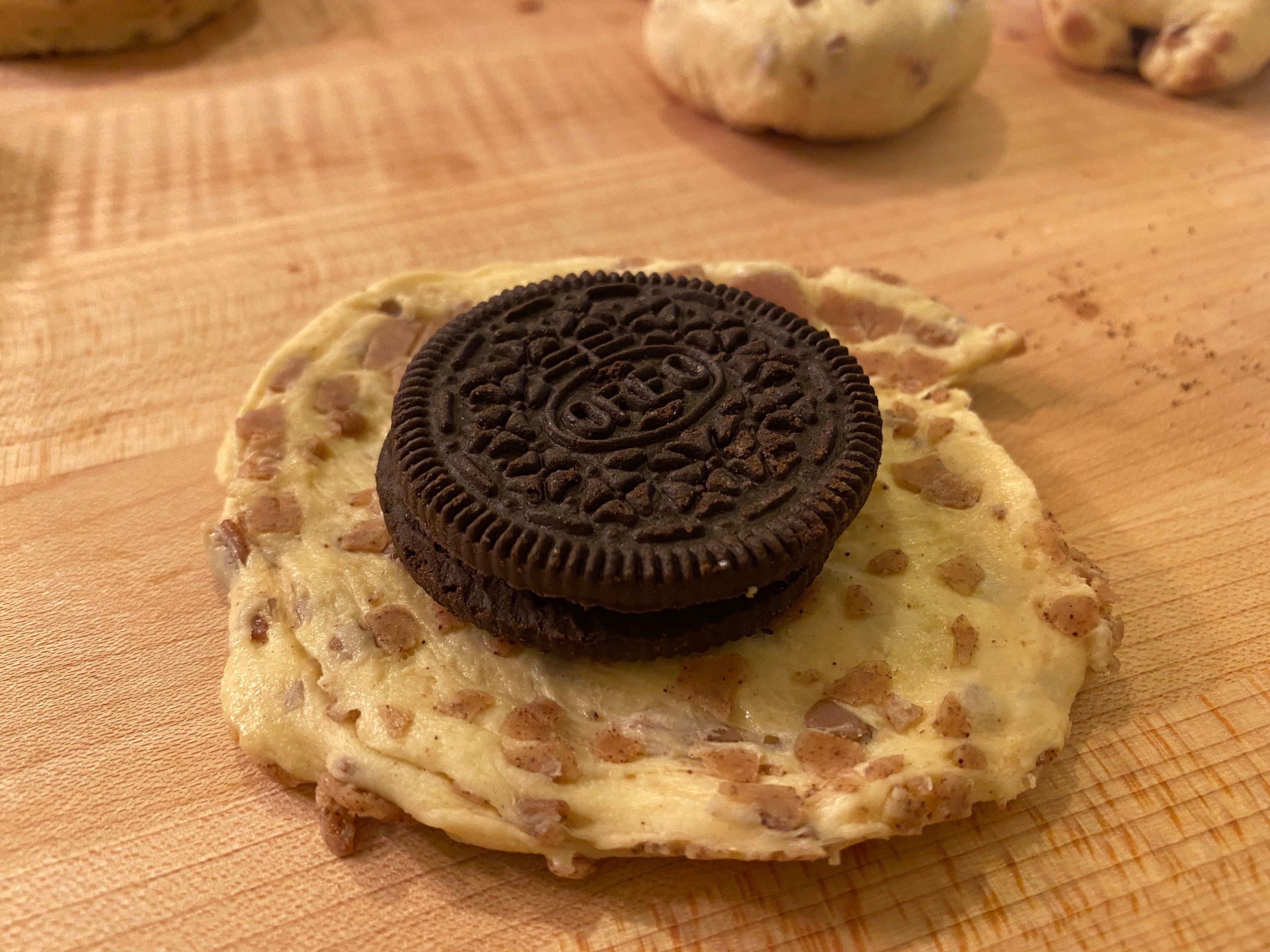 wrapping oreo in cinnamon bun dough