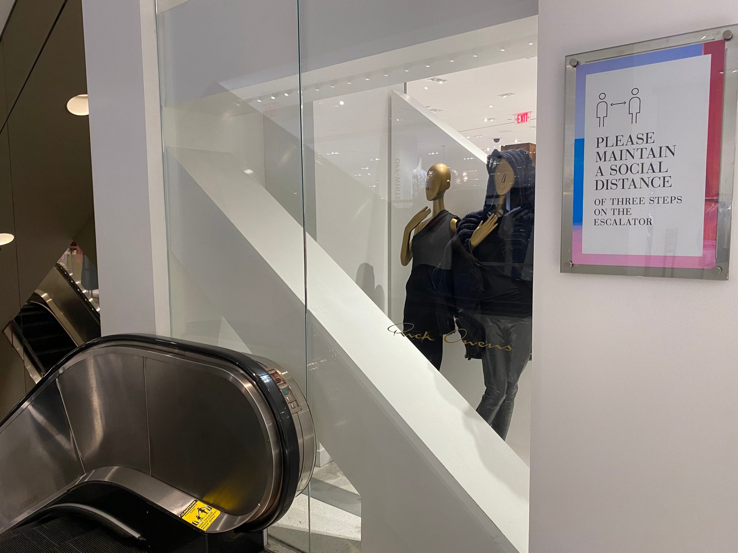 Social distancing messaging near an escalator at Saks. Michelle Gross