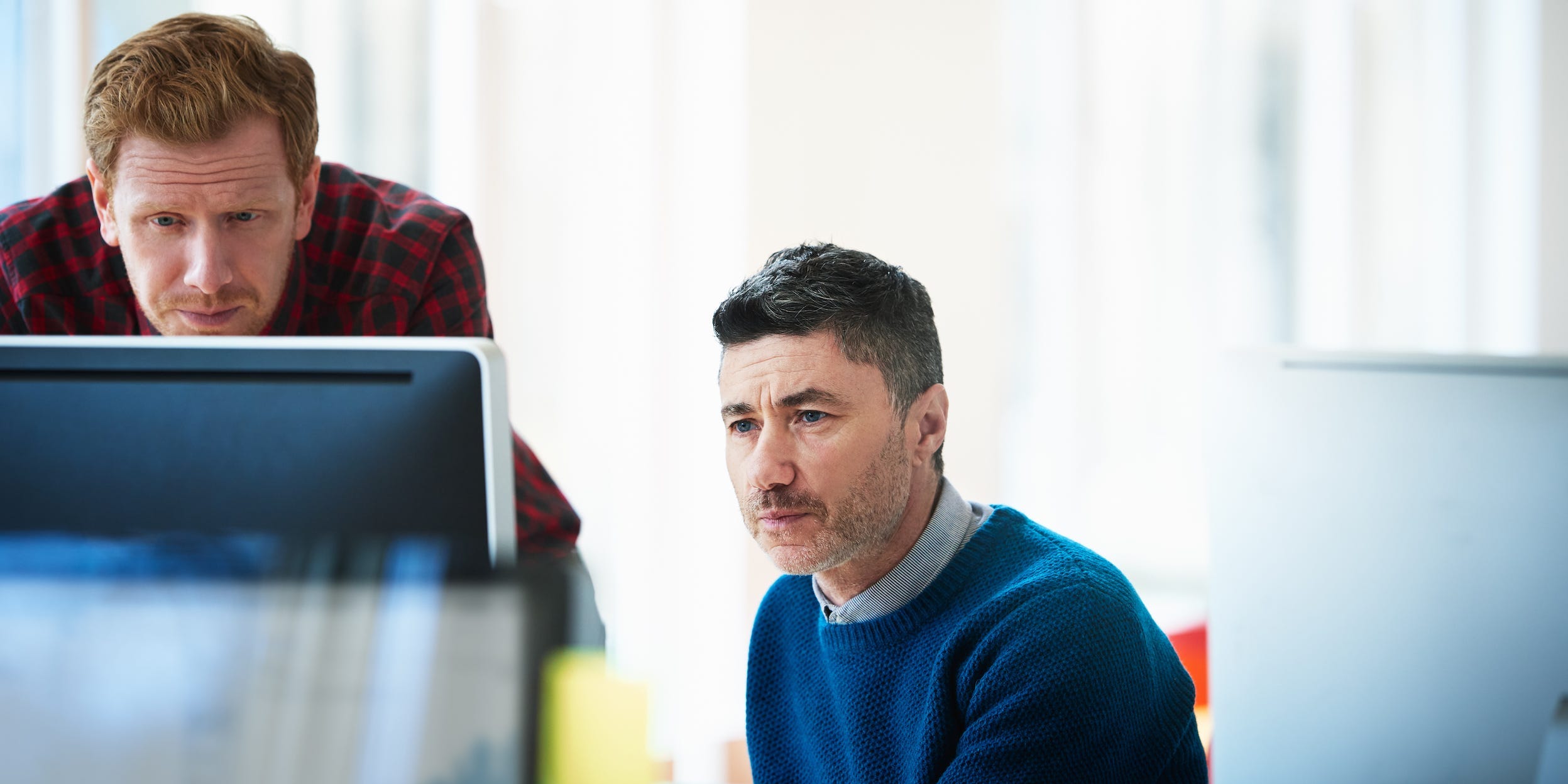 coworkers using computer