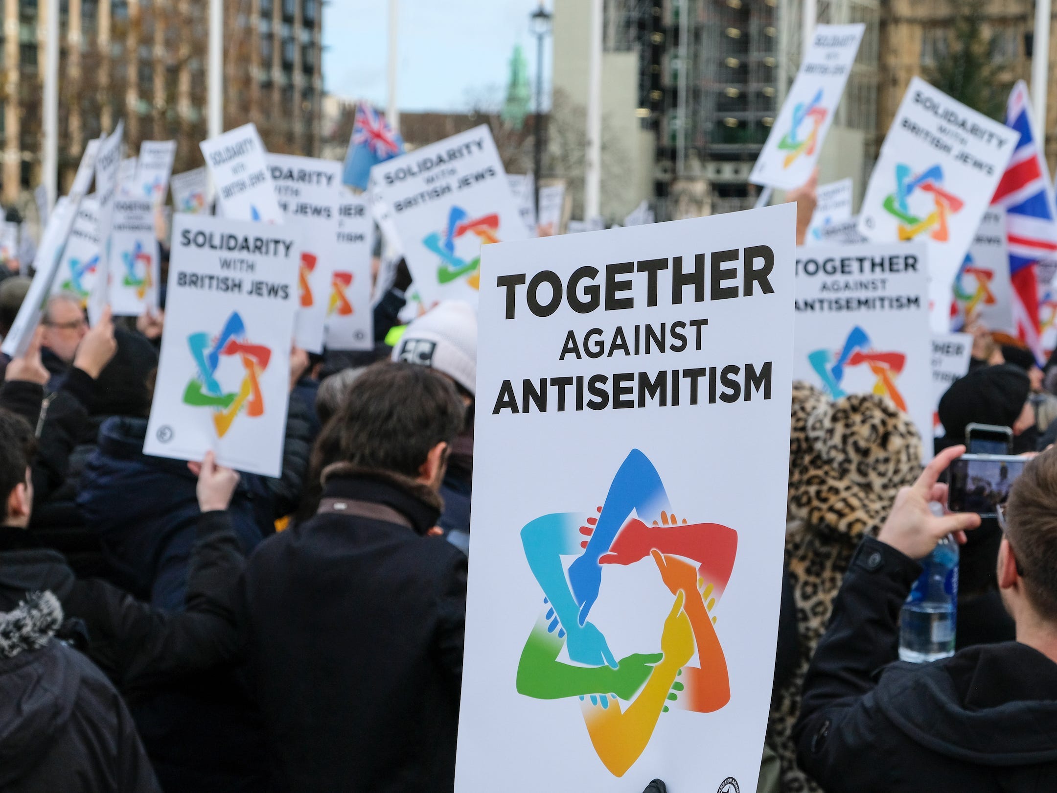 People stage a Together Against Antisemitism rally in London's Parliament Square in December 2019.