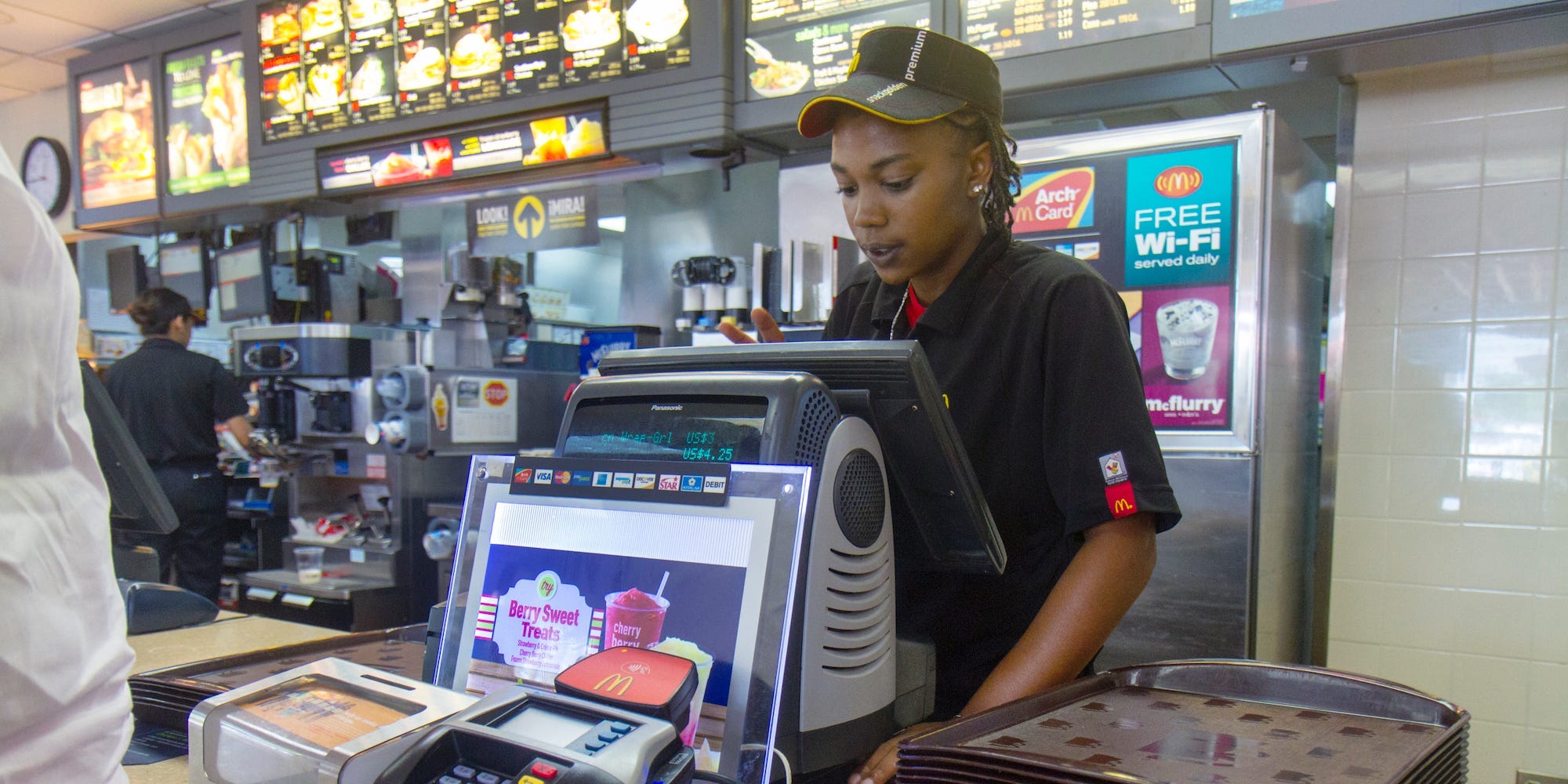 A cashier working behind the counter at McDonalds in Fort Pierce.