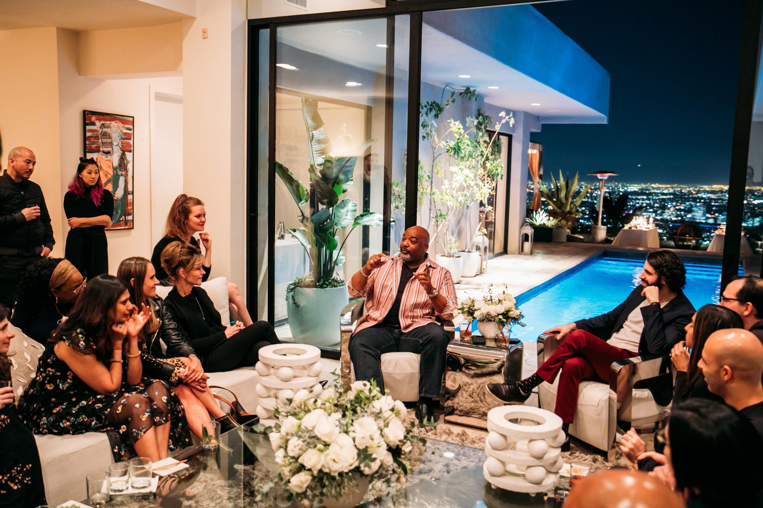 Several Influencers Dinner alumni participate in a salon hosted by Jon Levy at a 2019 event.